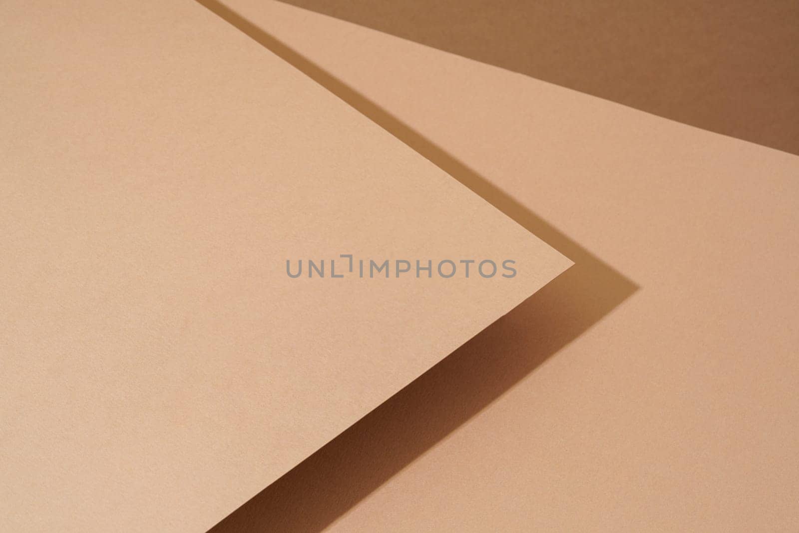 Colorful background from brown paper with shadow. Abstract geometric