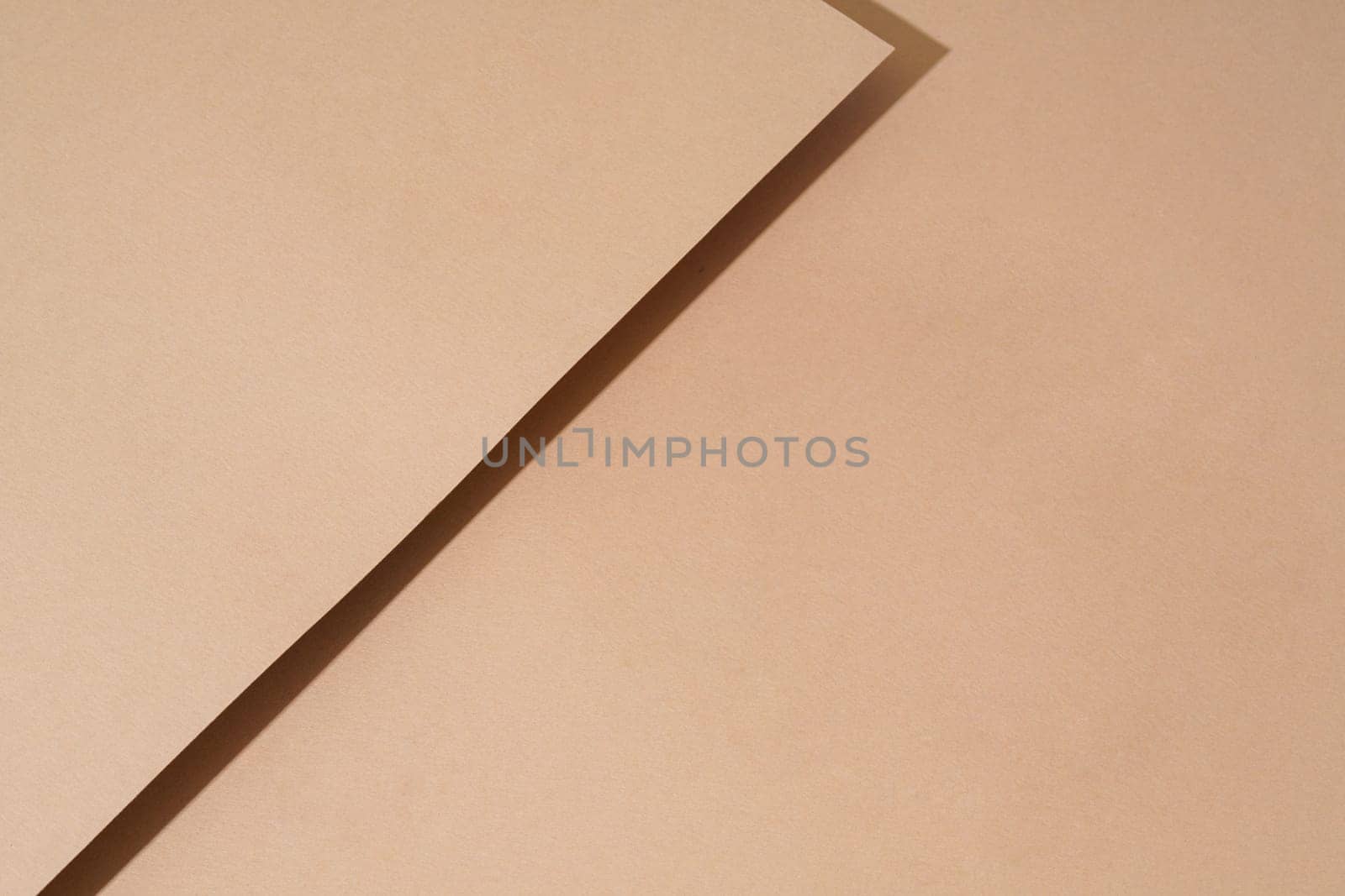 Colorful background from brown paper with shadow. Abstract geometric