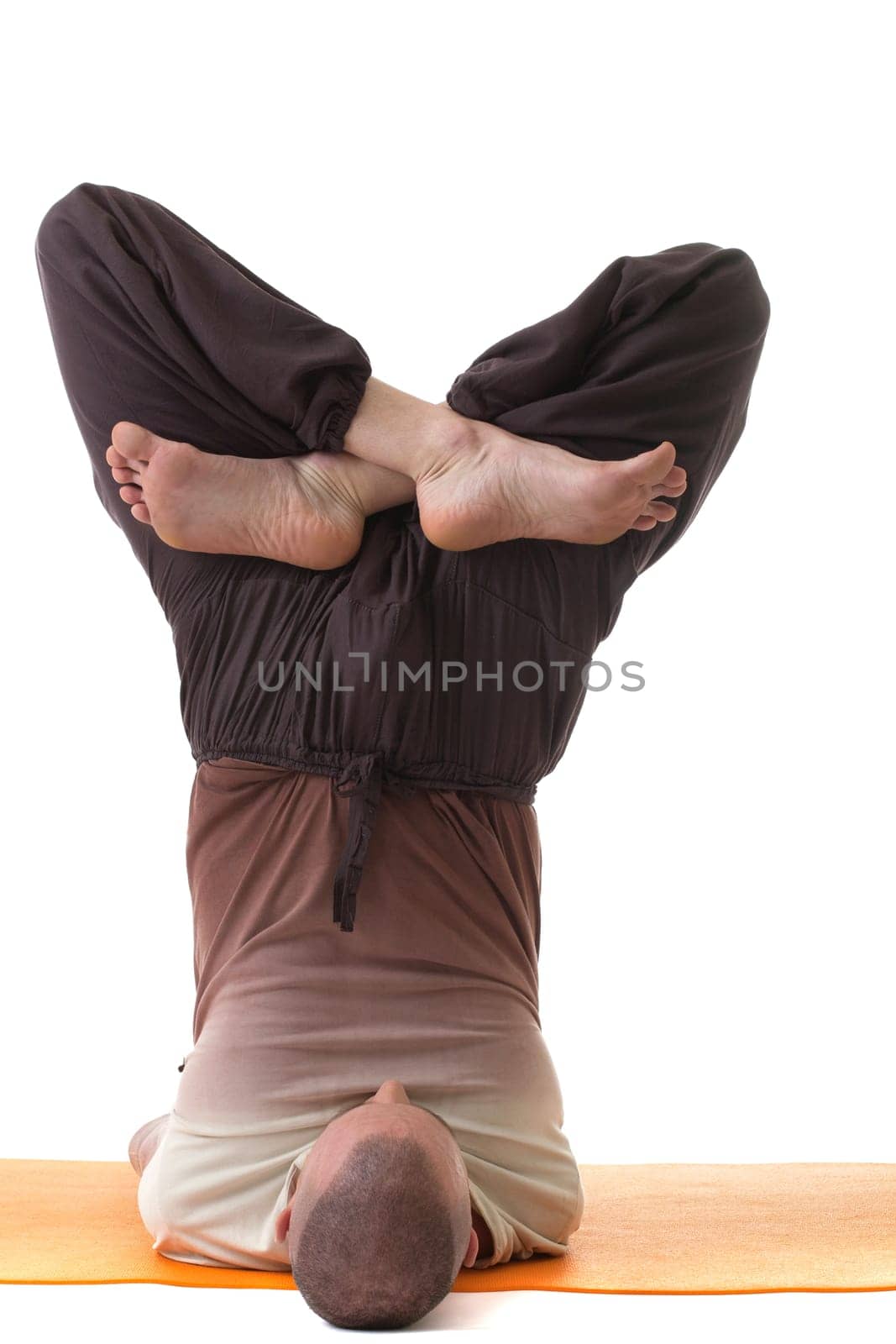 Image of flexible yogi posing in difficult pose, isolated on white