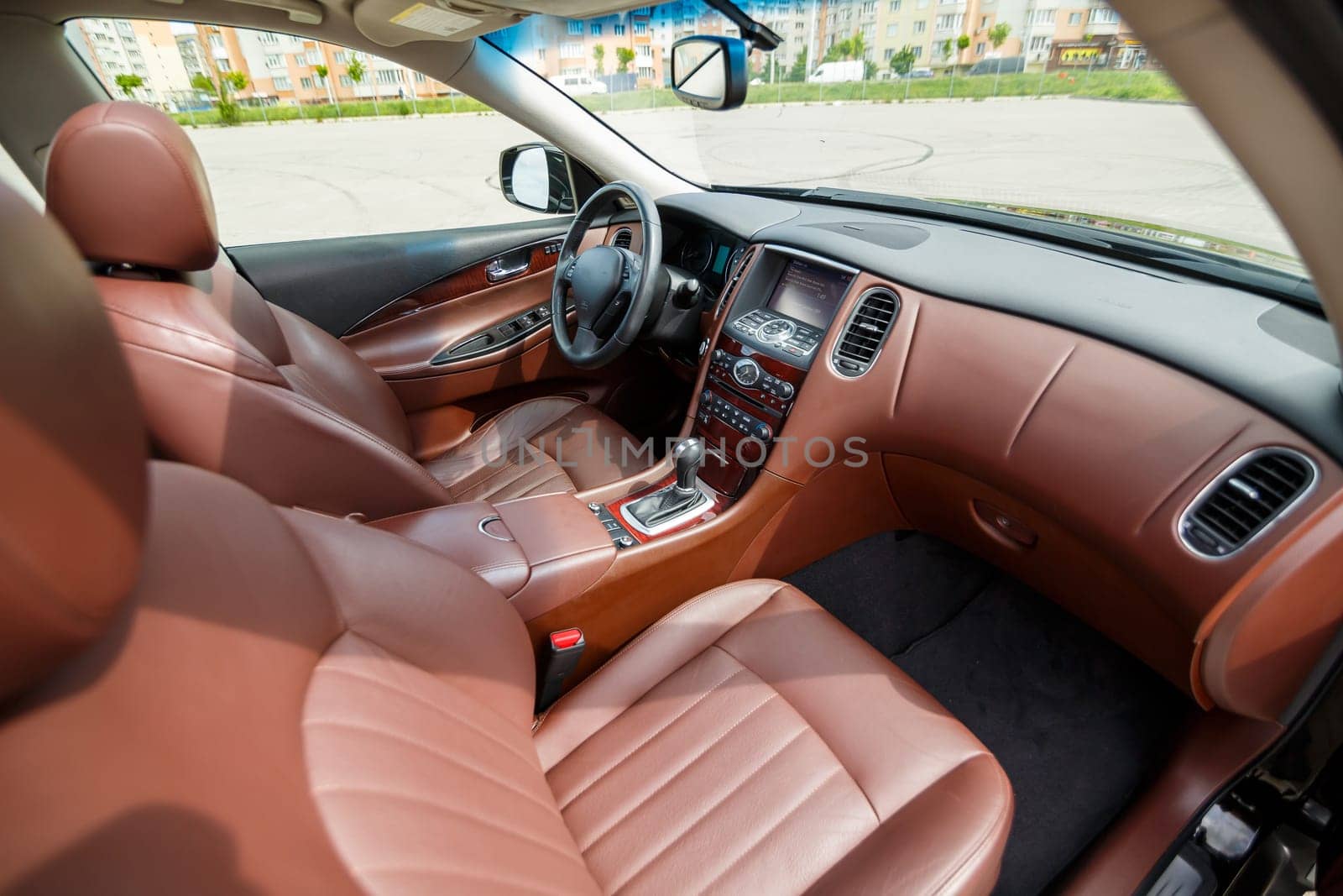 Modern SUV interior with leather panel, multimedia and dashboard