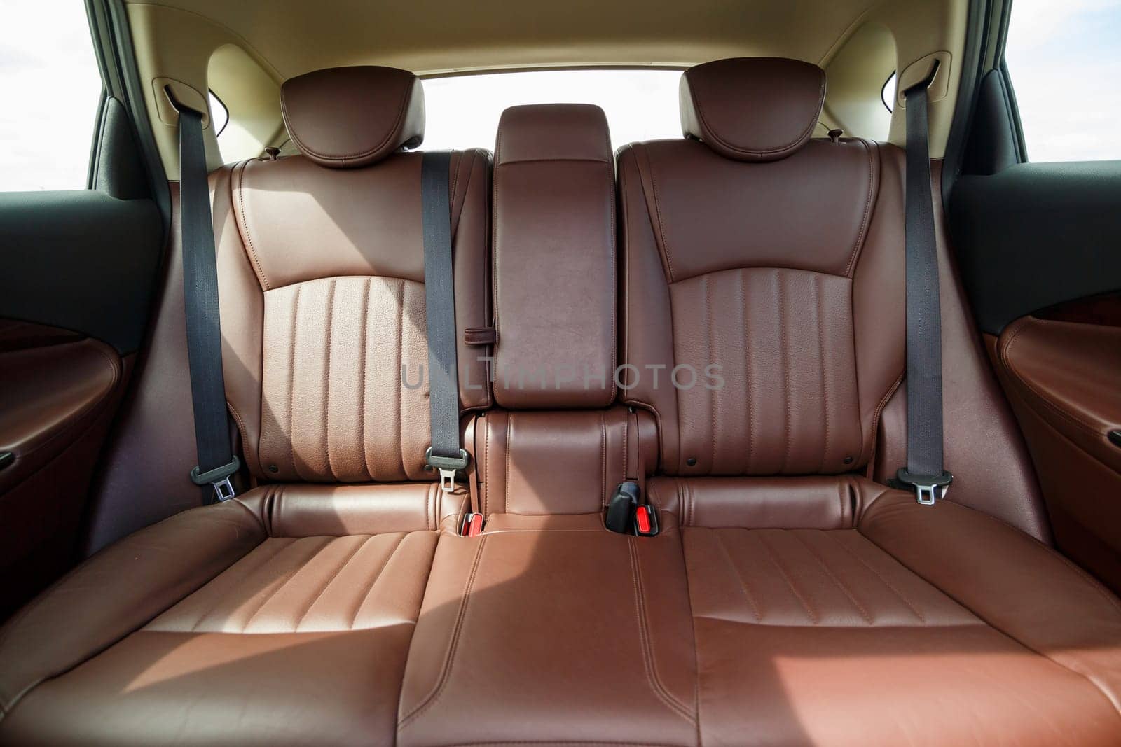 Brown leather seats in the new car. Interior upholstery with genuine leather.