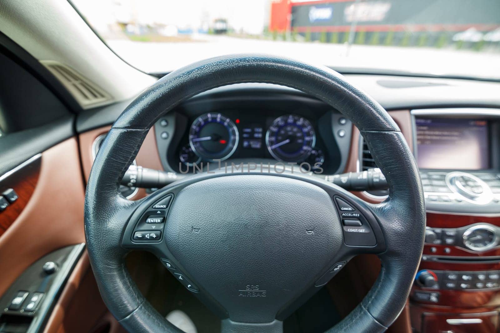 Close-up of a speedometer in a car. Car dashboard. Dashboard details with indicator lamps. Car dashboard. Steering wheel