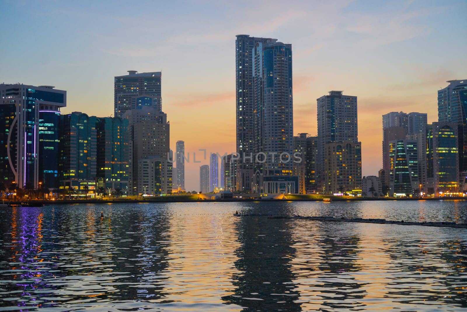 Night landscape of the embankment of the emirate of Sharjah, United Arab Emirates. by Ekaterina34