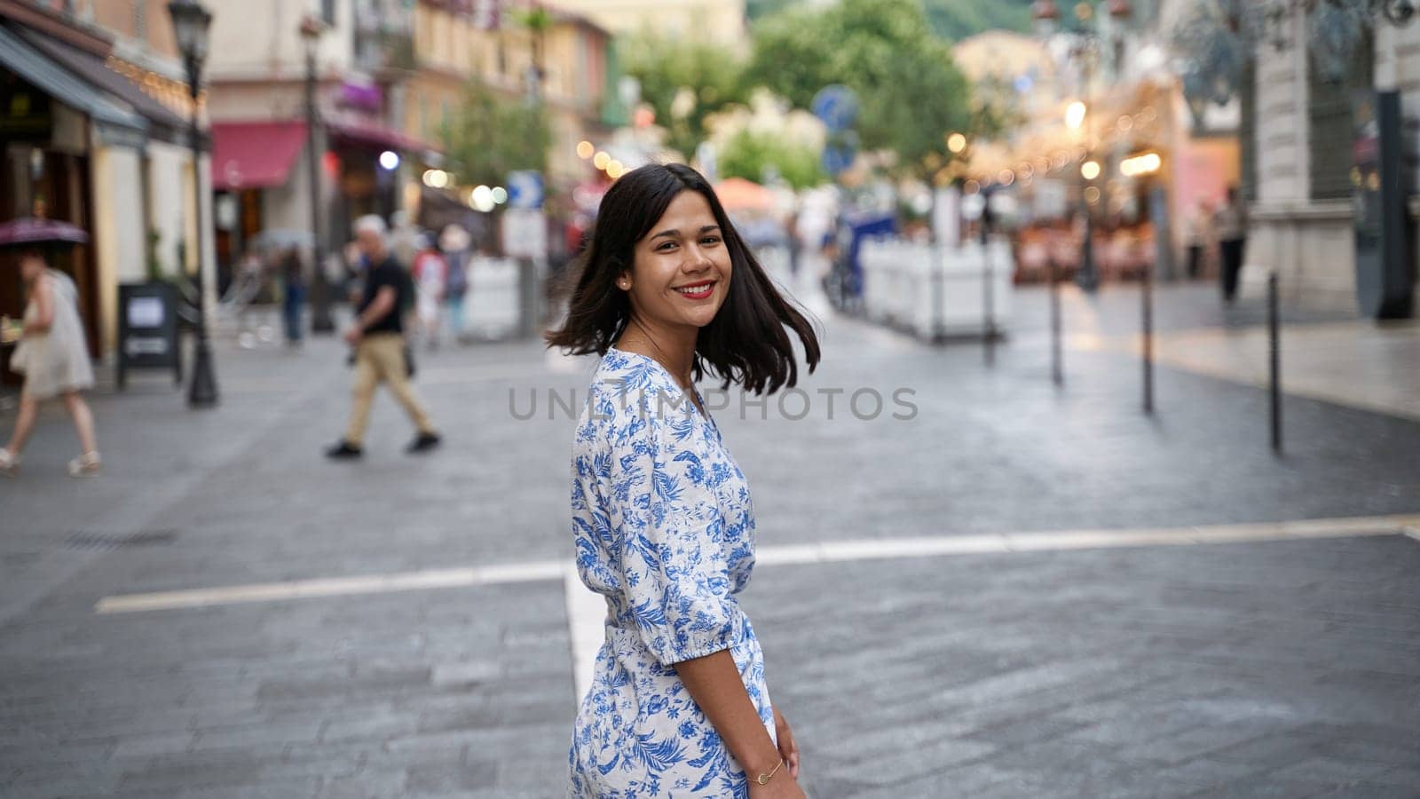 Beautiful young mixed race woman in the old town of Nice, France by berezko