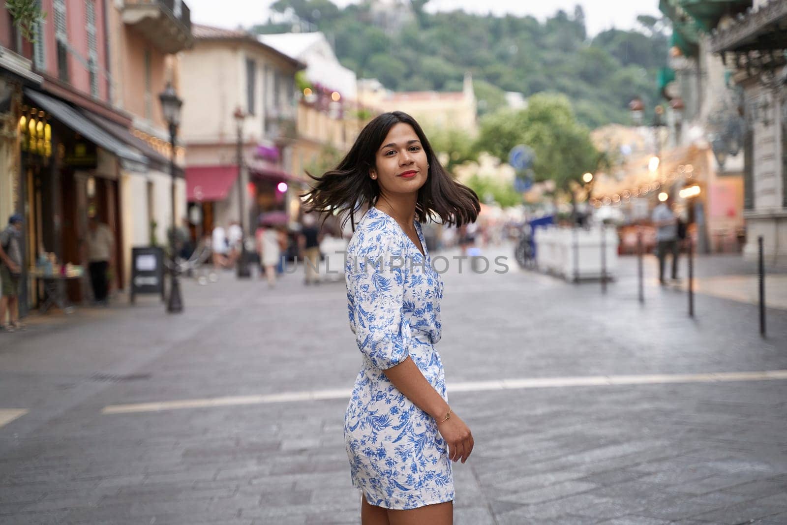 Beautiful young mixed race woman in the old town of Nice, France by berezko