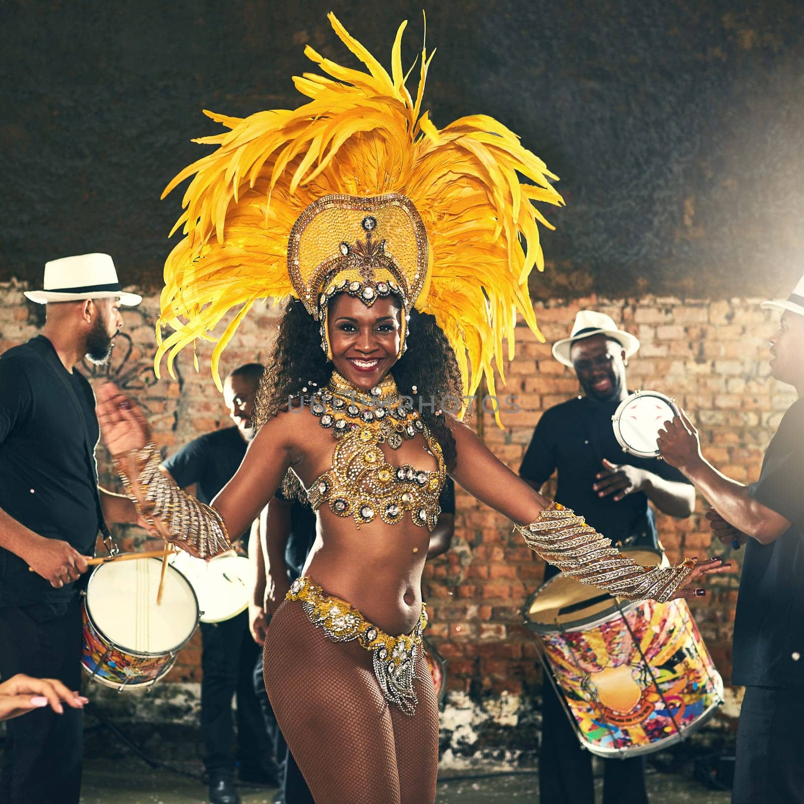 Samba, dance and black woman at Carnival to celebrate, night energy and holiday party in Rio de Janeiro, Brazil. Street band, music smile and portrait of a dancer at an outdoor festival dancing.