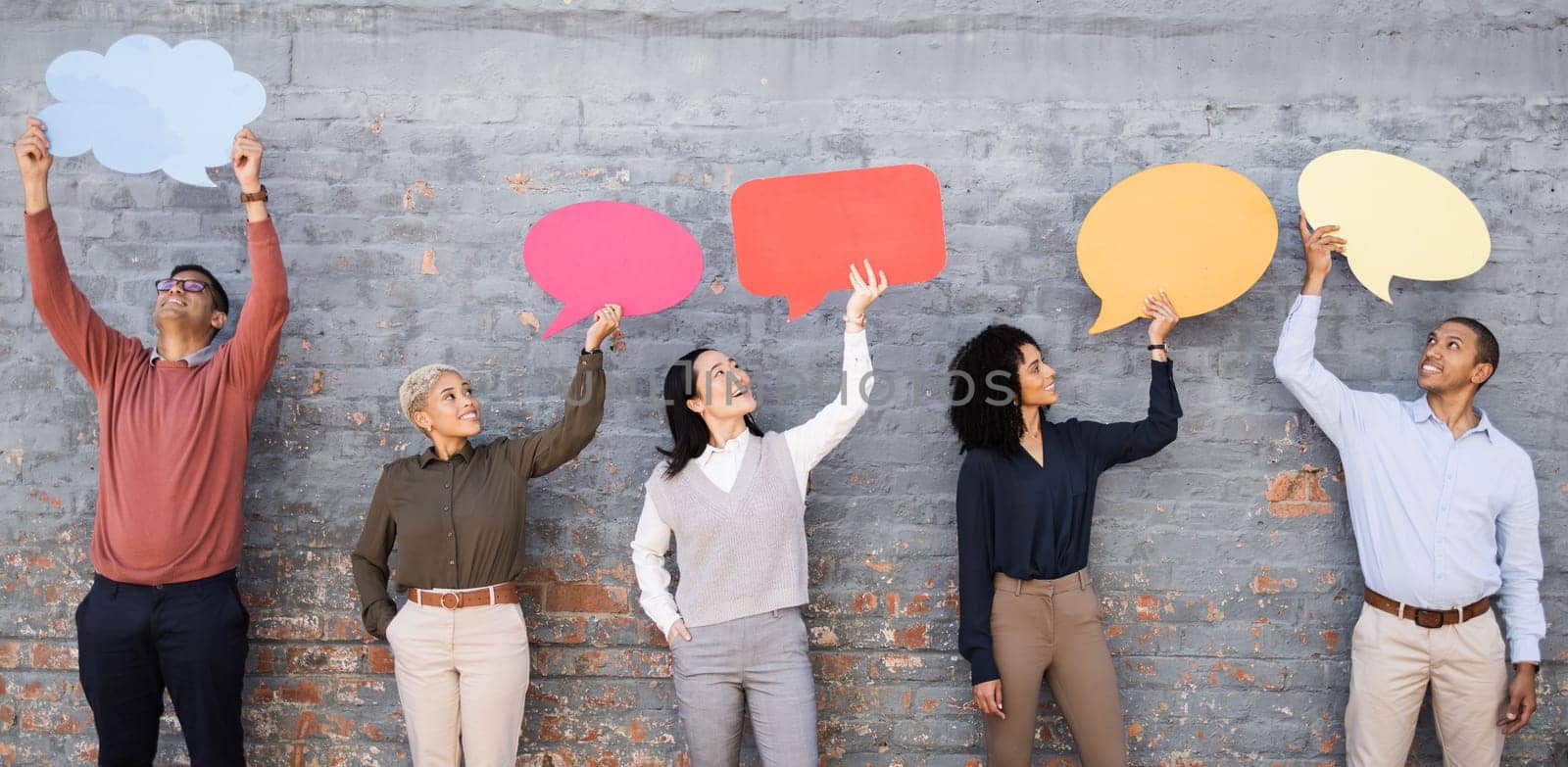 Speech bubble, communication and news with business people and mockup for social media, vote and review. Design, contact and chat sign with employee and board at brick wall for voice and opinion.