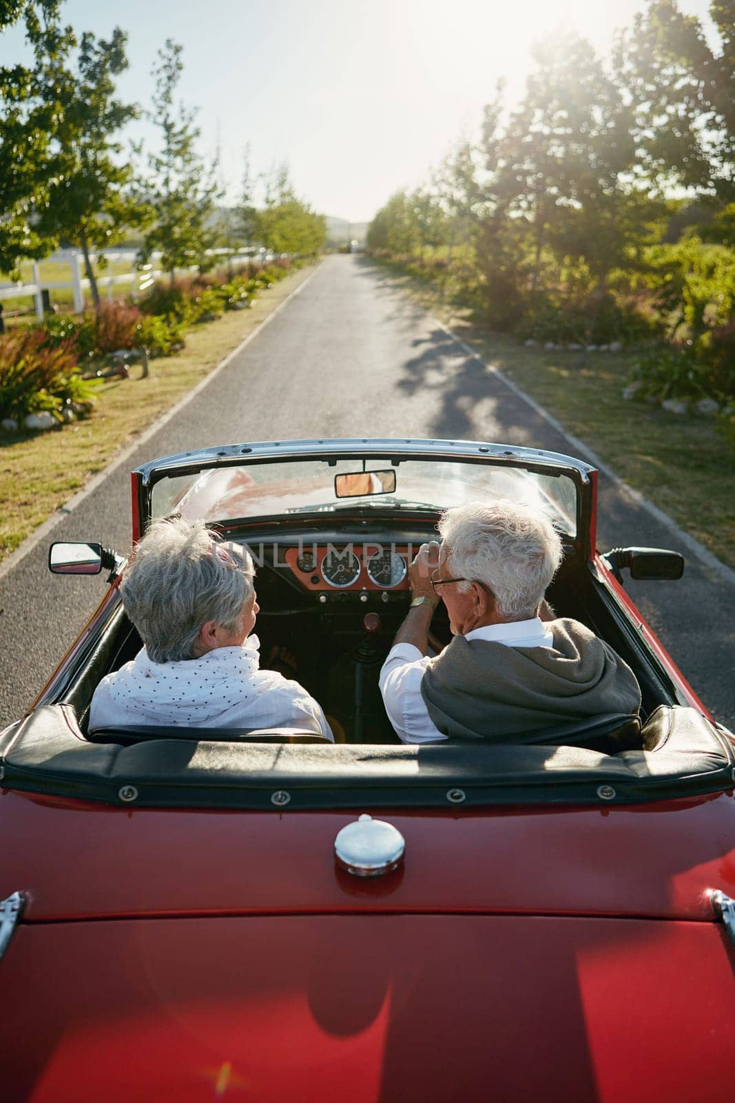 Retirement is even more fun that youve heard. a senior couple going on a road trip. by YuriArcurs