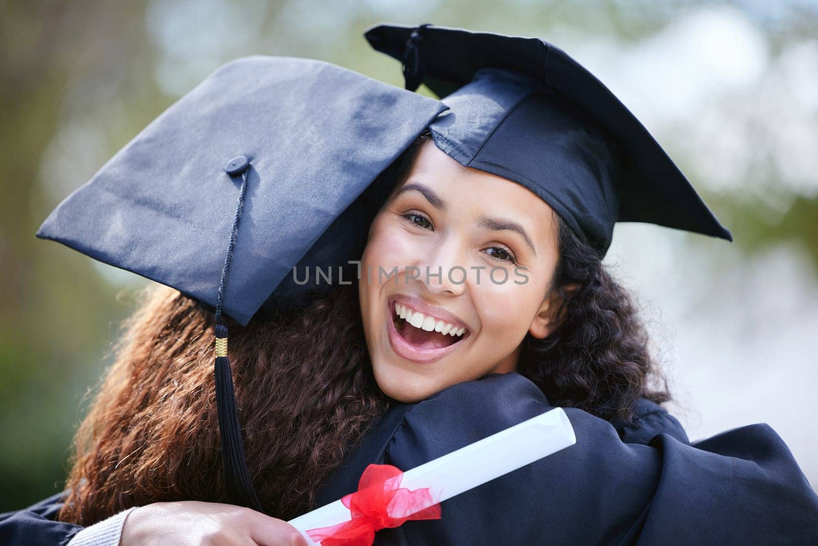 Happy, portrait of friends hugging and on graduation day at college campus outside. Celebration or success, achievement or education and excited students hug together at university outdoors