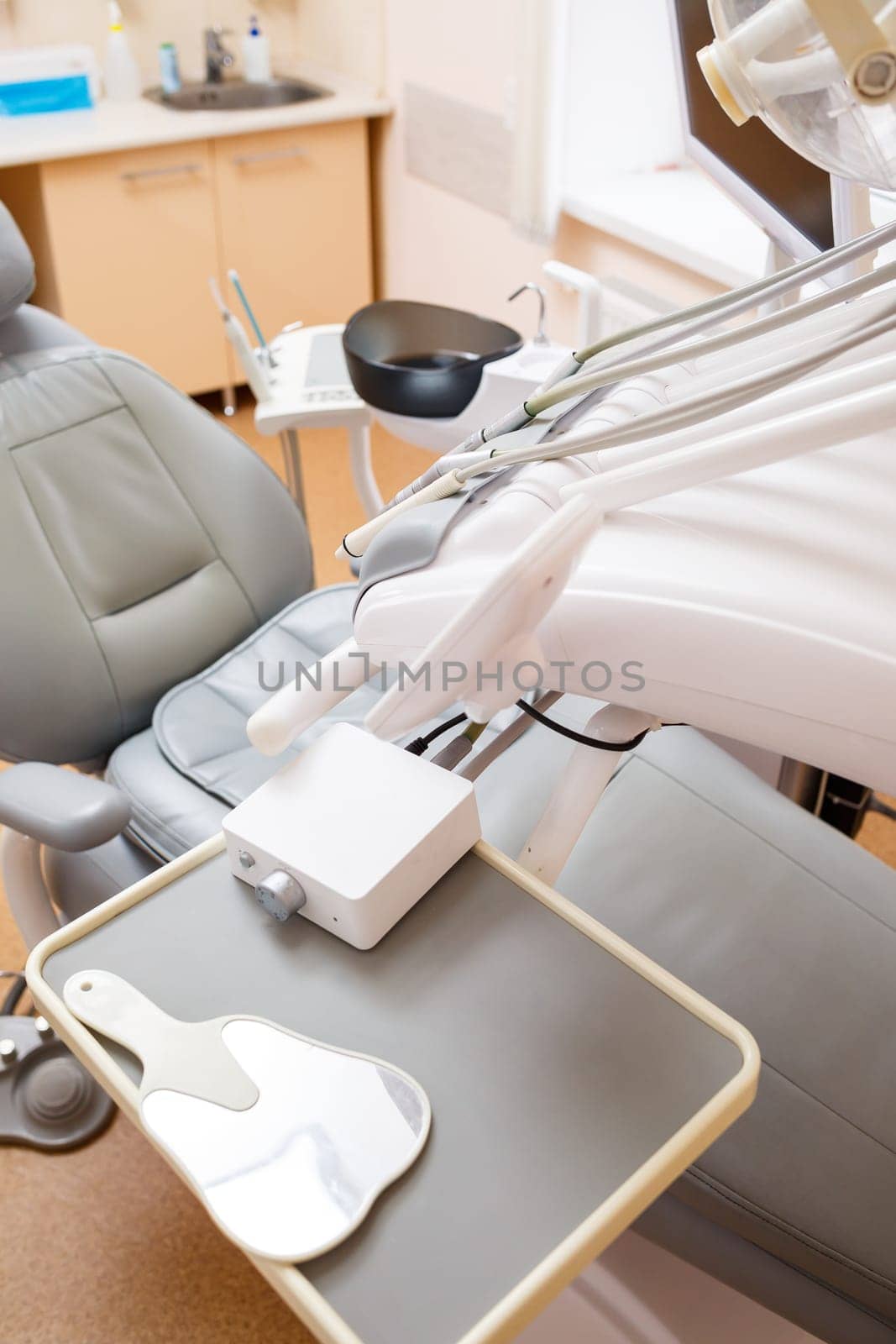 Dental treatment device for patients. The workplace of a professional dentist. Healthy teeth. Dental office with nobody in