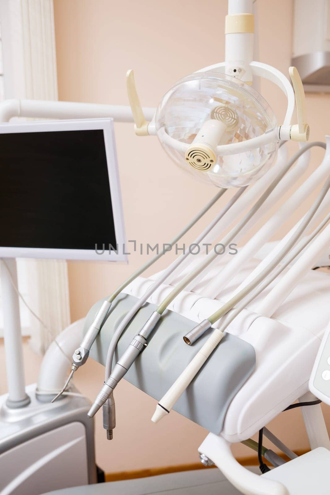 Dental treatment device for patients. The workplace of a professional dentist. Healthy teeth. Dental office with nobody in