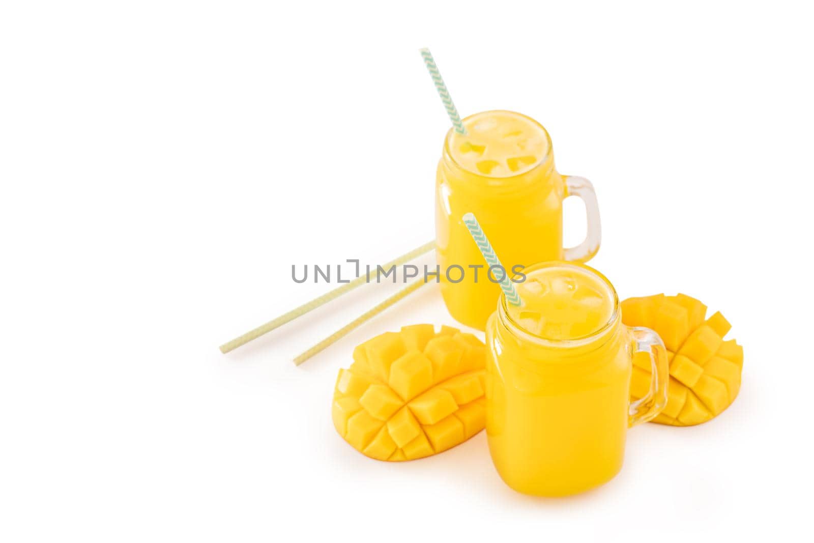 Fresh tropical mango juice with beautiful diced fruit flesh, striped paper straw isolated on white background table, close up, cut out, clipping path. by ROMIXIMAGE