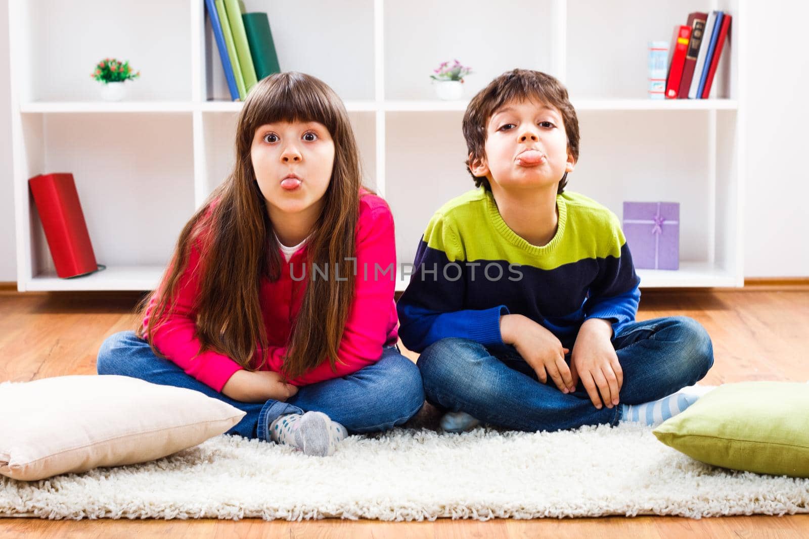 Image of children sticking out tongue.