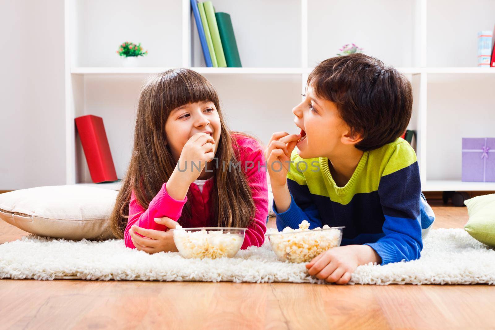 Image of children eating popcorn