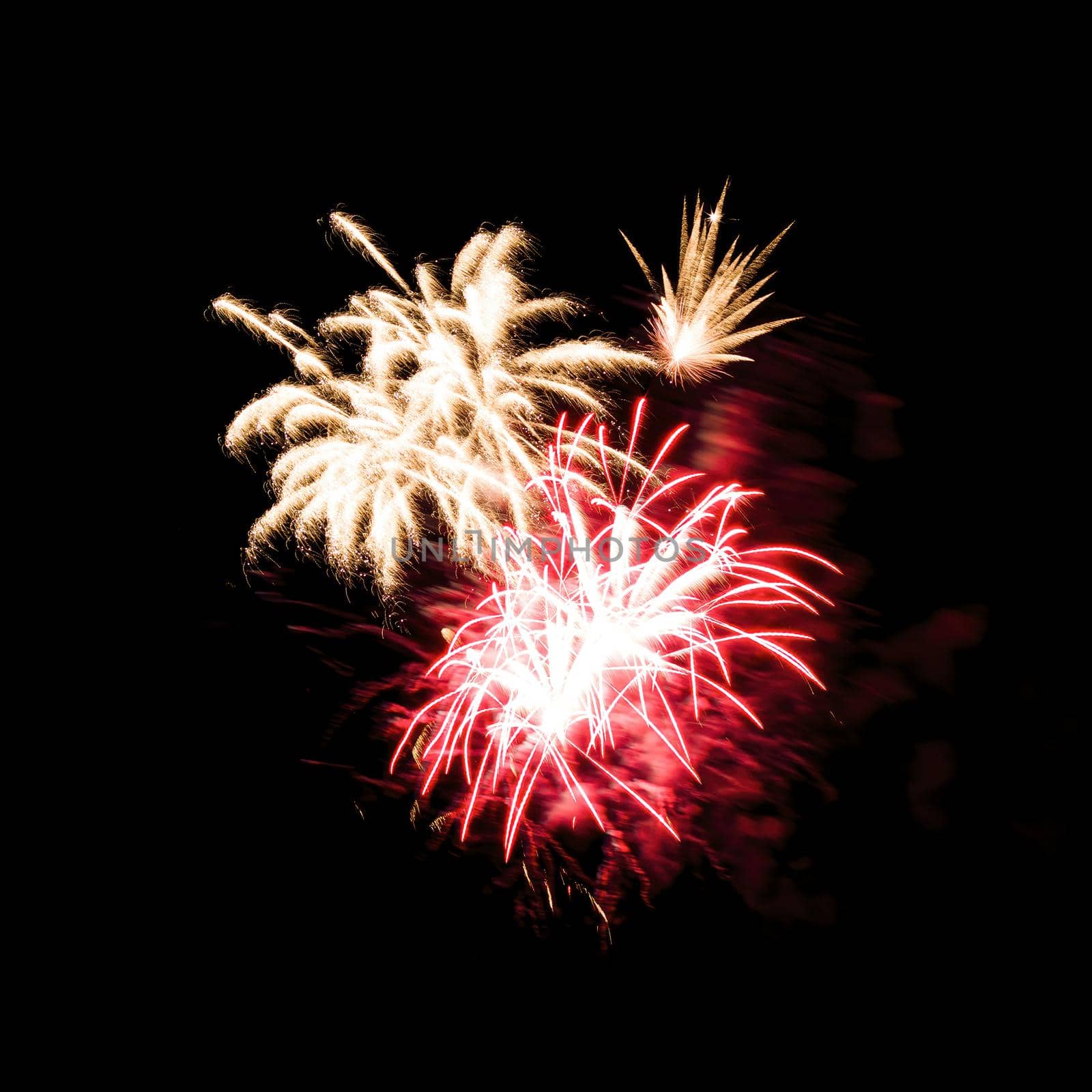 Colorful fireworks isolated on black sky background.