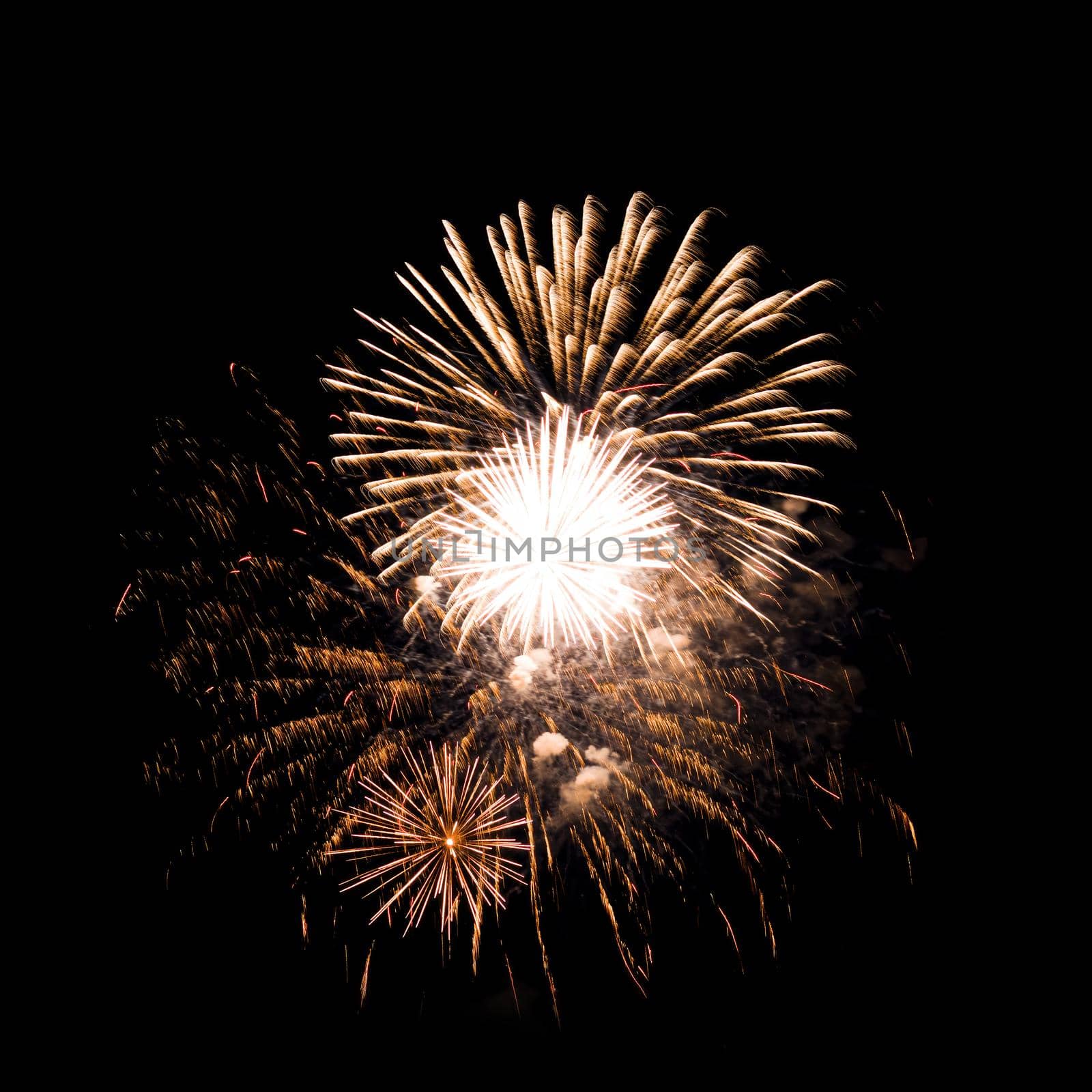 Colorful fireworks isolated on black sky background.