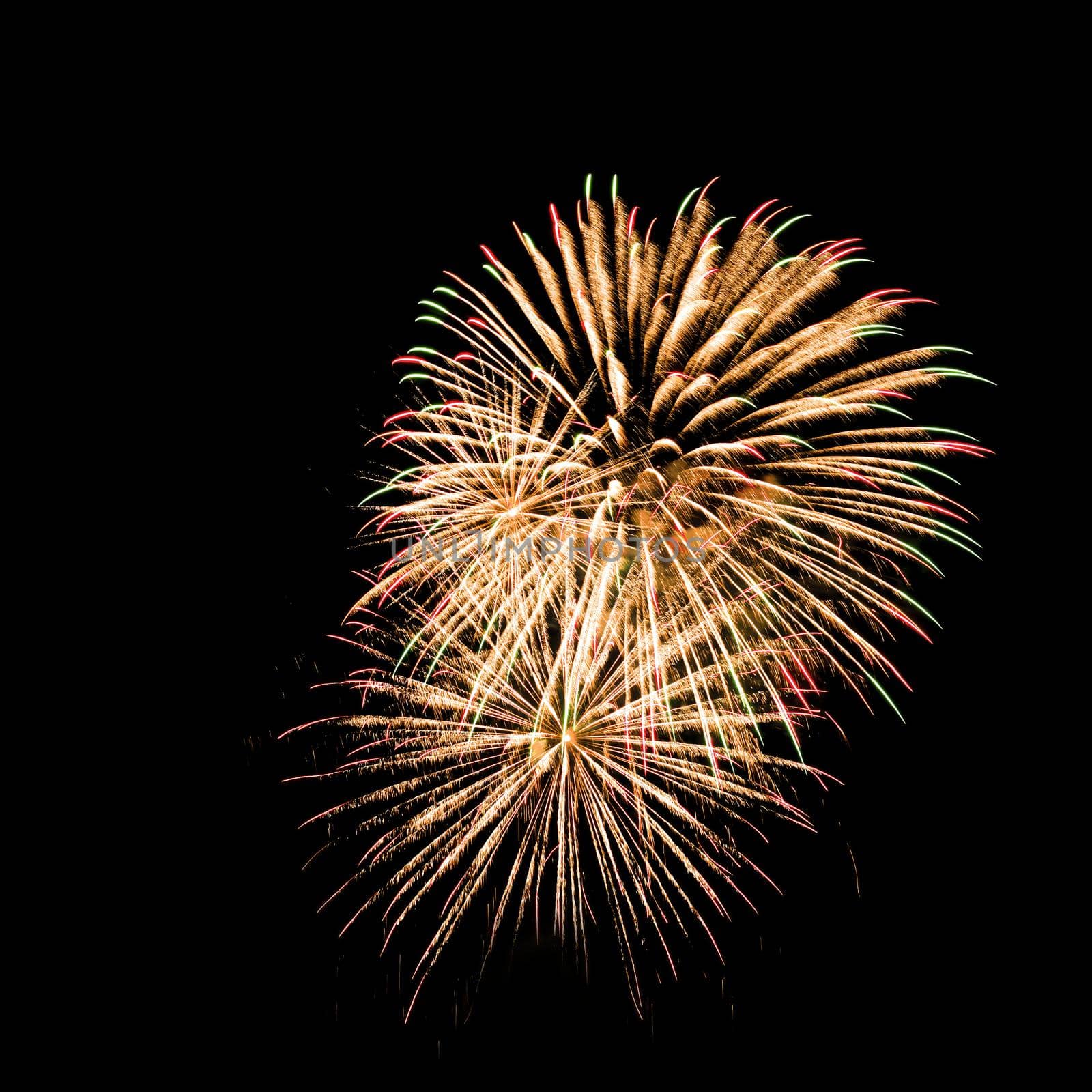 Colorful fireworks isolated on black sky background.