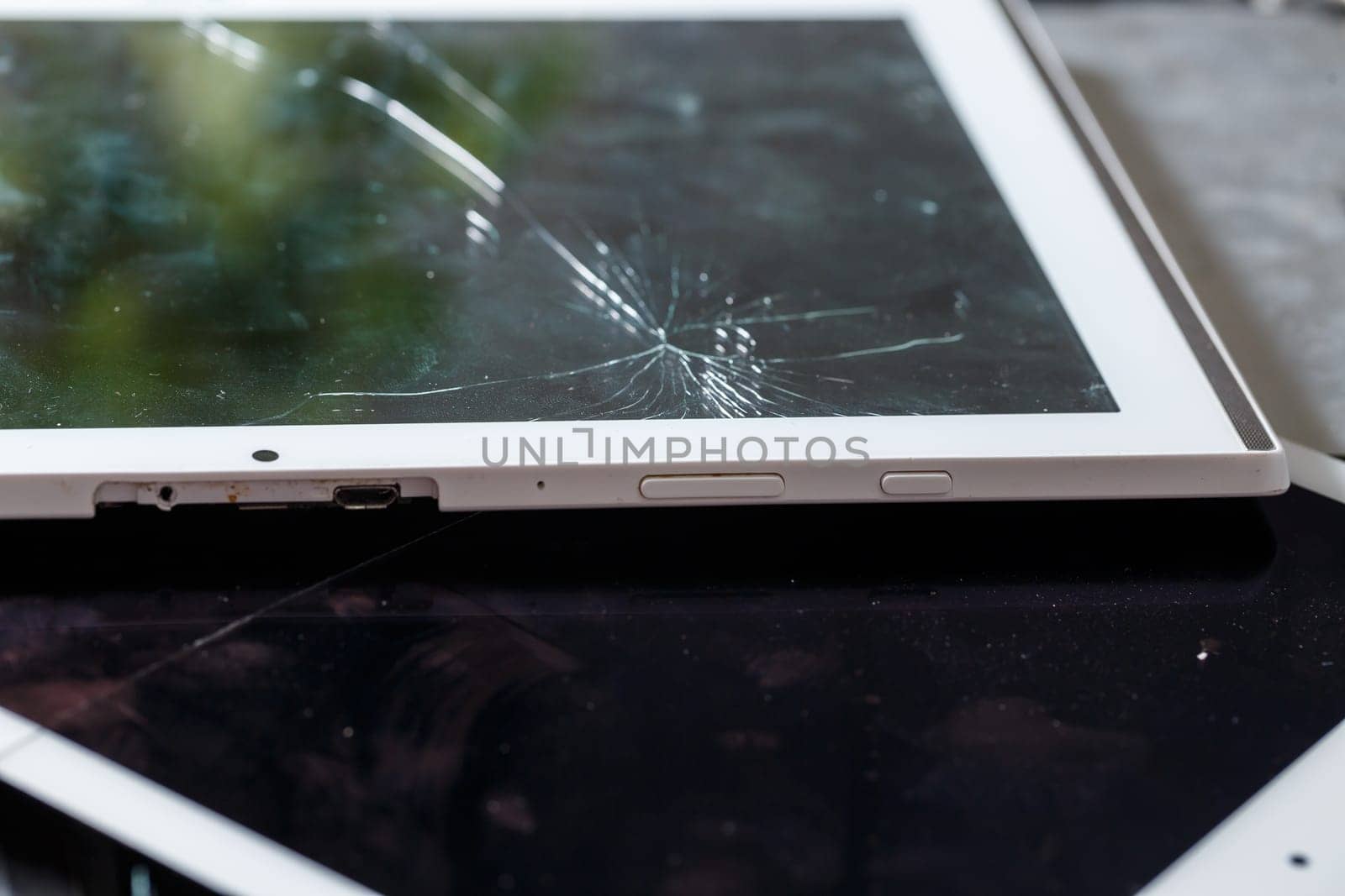 Tablet repair, replacement of glass on the tablet. Broken glass on a mobile device