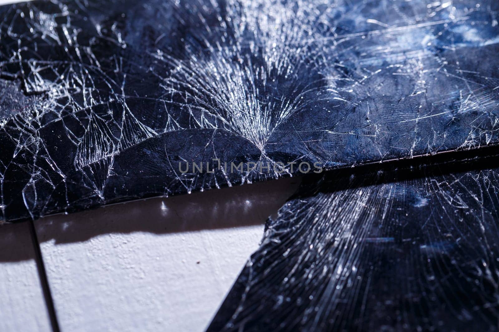 Mobile tablet device with a broken badly cracked shattered glass on the touch screen. Smart hardware part replacement, fixing concept