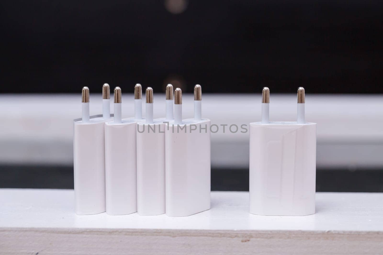 Chargers blocks for charging the phone in white.