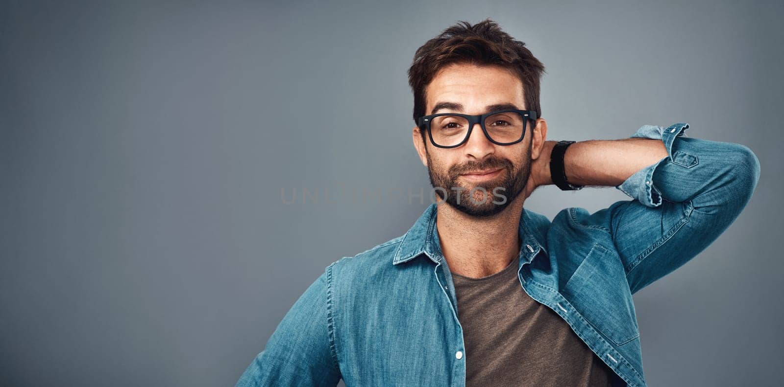 Hes just that good. Studio shot of a handsome young man posing against a grey background