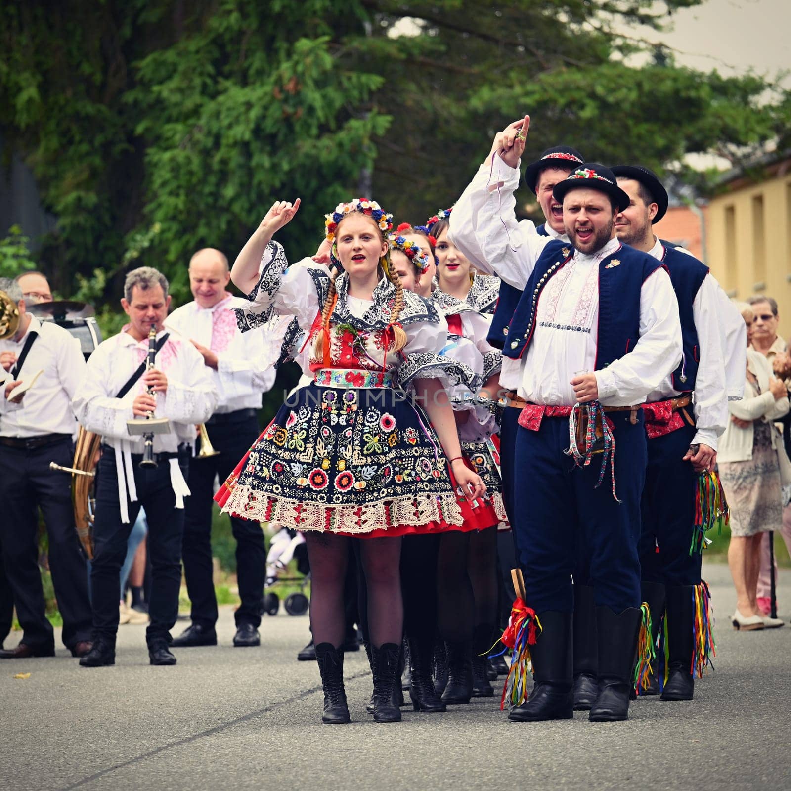 Brno - Bystrc, Czech Republic, 24 June, 2023. Traditional festivities of the feast of the feast in the Czech Republic. Food and drink festival. Girls and boys dancing in beautiful colourful traditional costumes. An old Czech custom of celebrating in villages.  by Montypeter