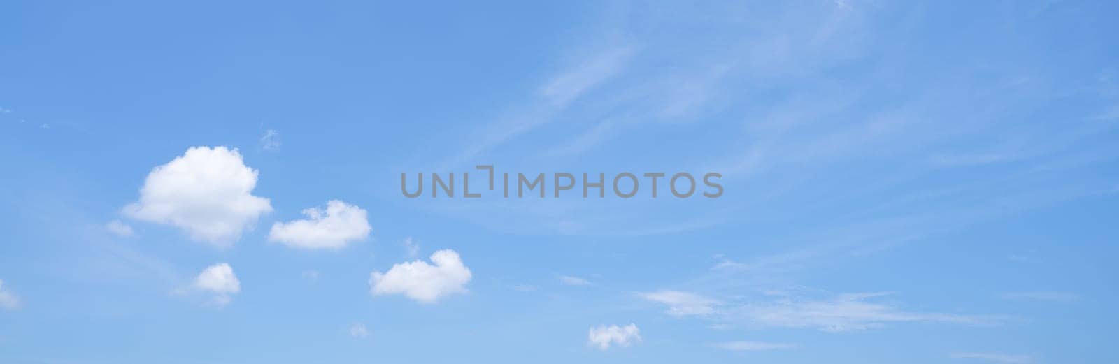 Beautiful blue sky and white cumulus clouds abstract background. Cloudscape background. Blue sky and fluffy white clouds on sunny days. Beautiful blue sky. World Ozone Day. Ozone layer. Summer sky. by Fahroni