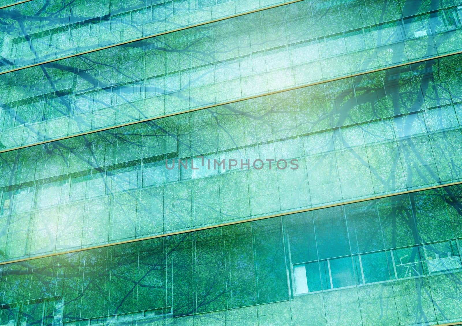 Eco-friendly building in modern city. Sustainable glass office building with trees to reduce carbon dioxide. Office building with green environment. Corporate building reduce CO2. Net zero emissions. by Fahroni