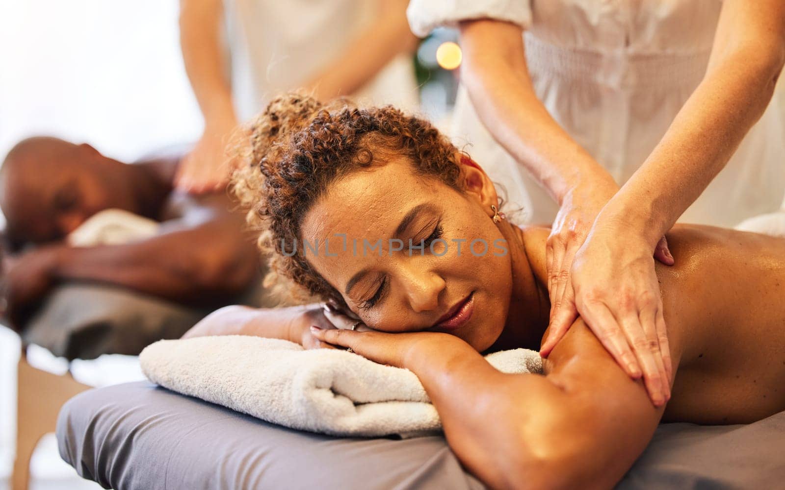 Couple massage, hands or spa therapist for relax, luxury or wellness treatment for health, lifestyle or zen at resort. Healthcare, beauty salon or black woman and man for body, skincare or therapy by YuriArcurs