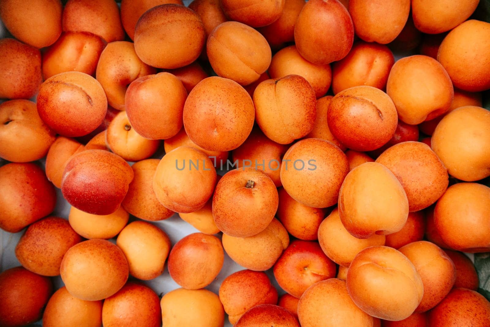 Fresh peaches on sale on a green market, overhead view