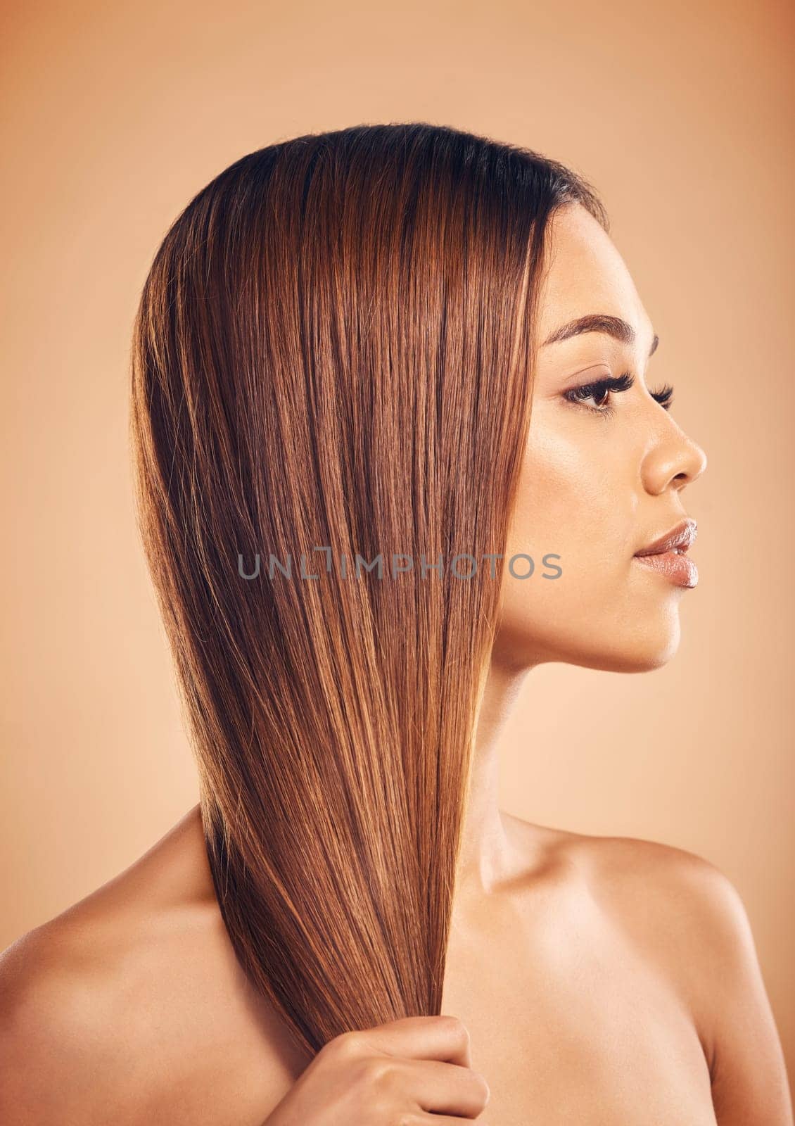 Woman, hair and beauty with hairstyle and profile, haircare and keratin treatment isolated on studio background. Female model with highlights, color and cosmetic care, texture and growth with shine.