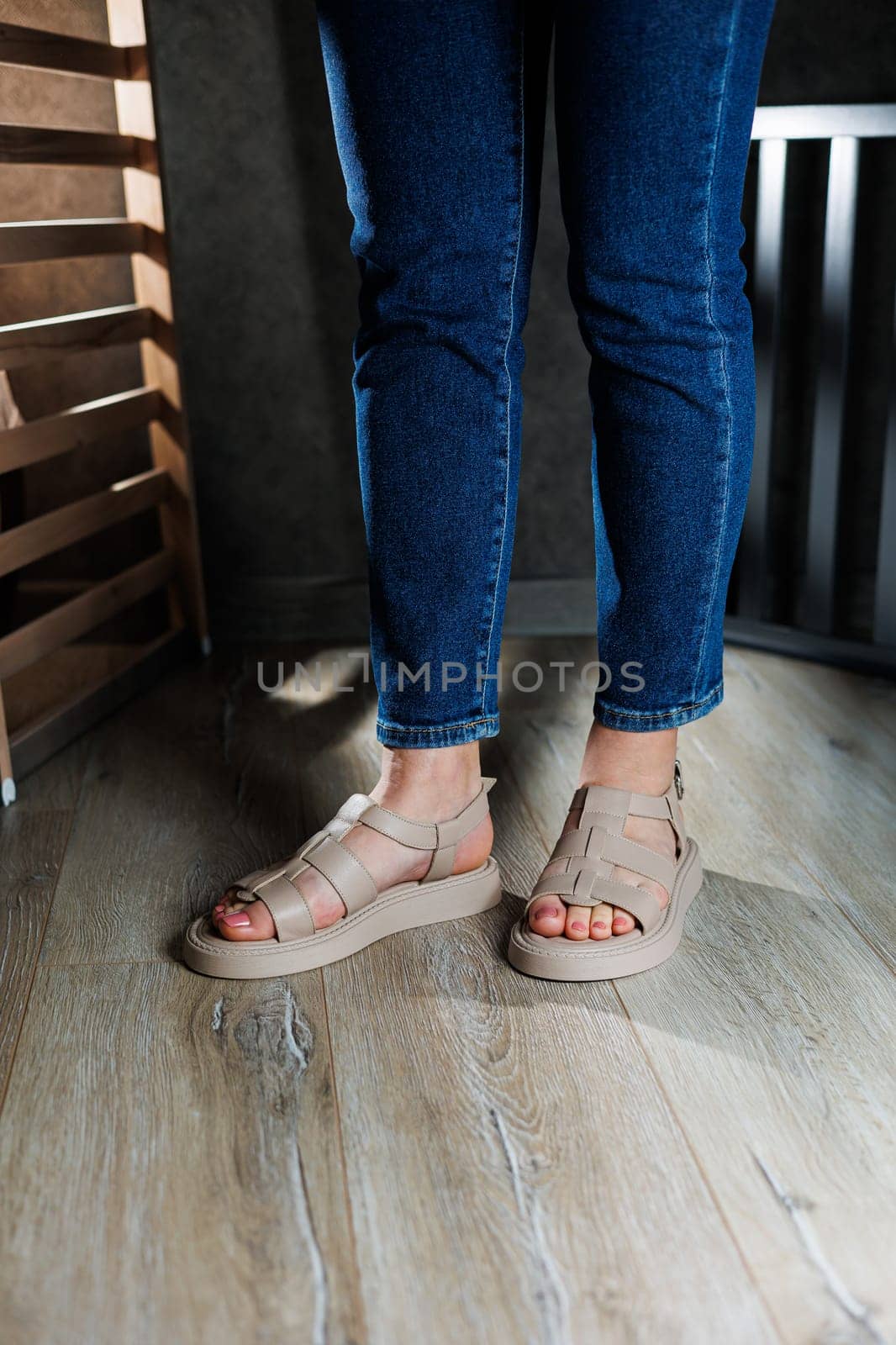 Summer women's sandals. Collection of women's leather summer sandals. Slender female legs in beige leather sandals without heels. by Dmitrytph
