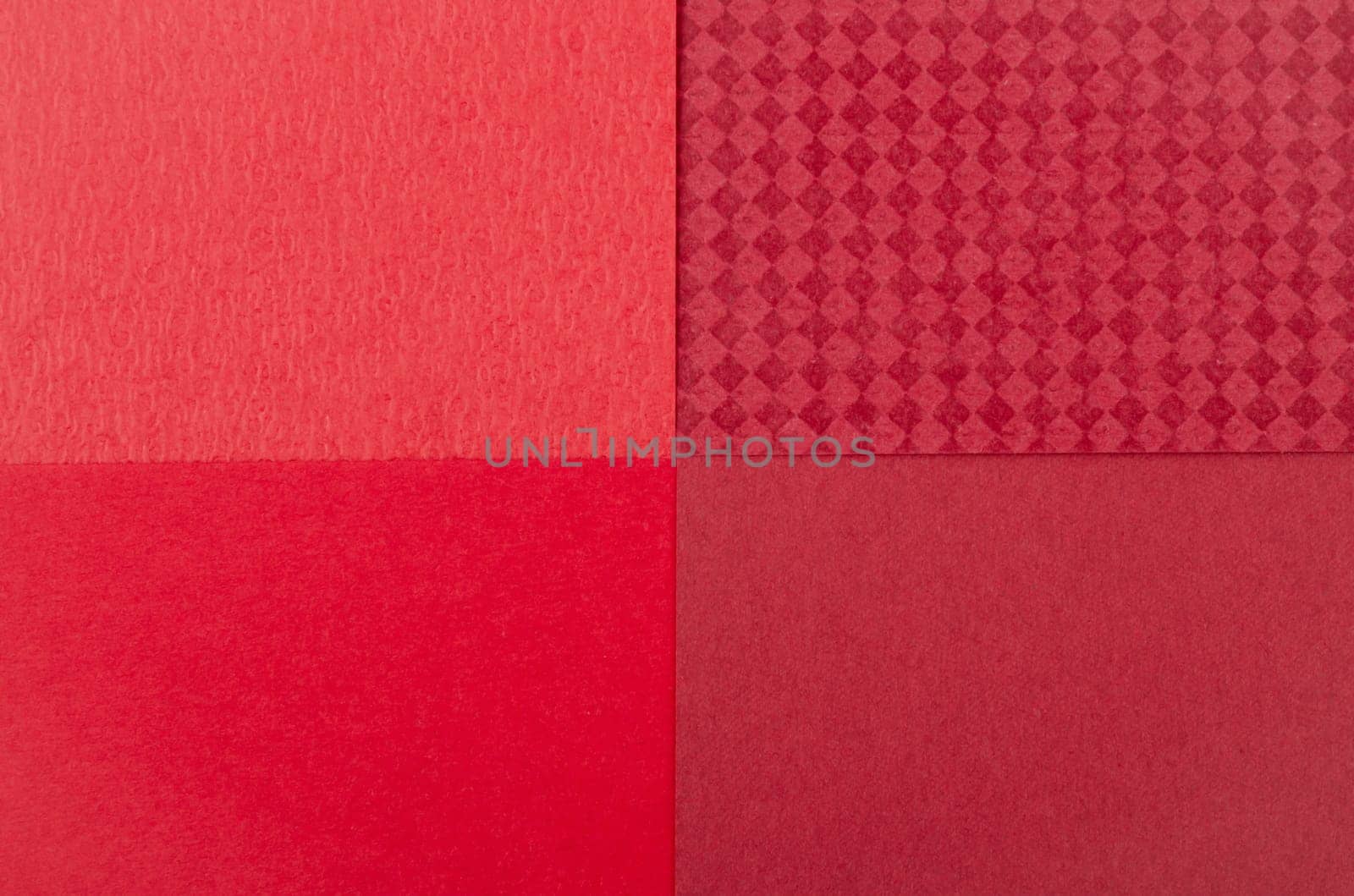 The Abstract mixed red paper texture is colorful background. by Gamjai
