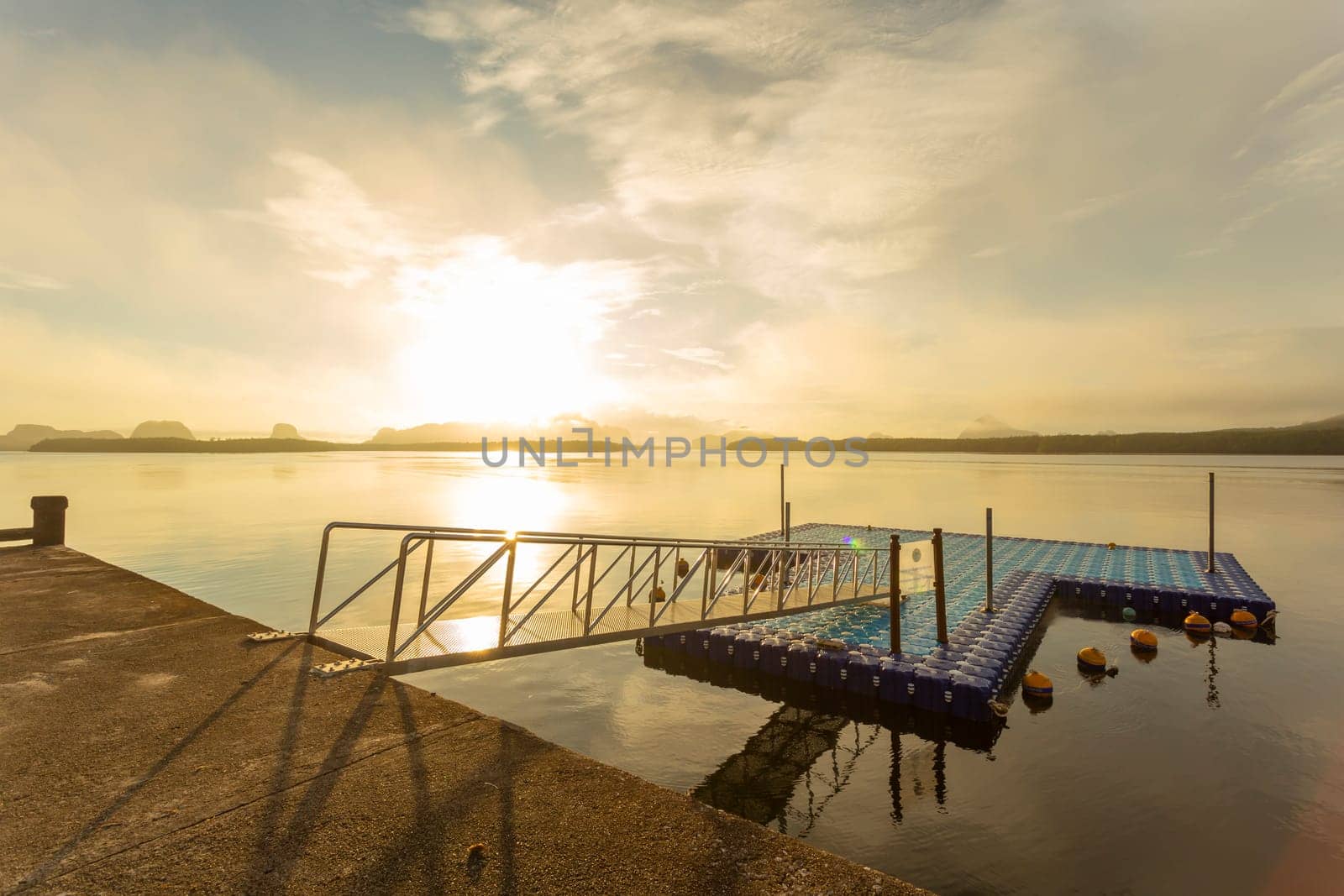 Tourism port in the colorful sunrise at Ban Sam Chong Tai, Phang nga province, Thailand.