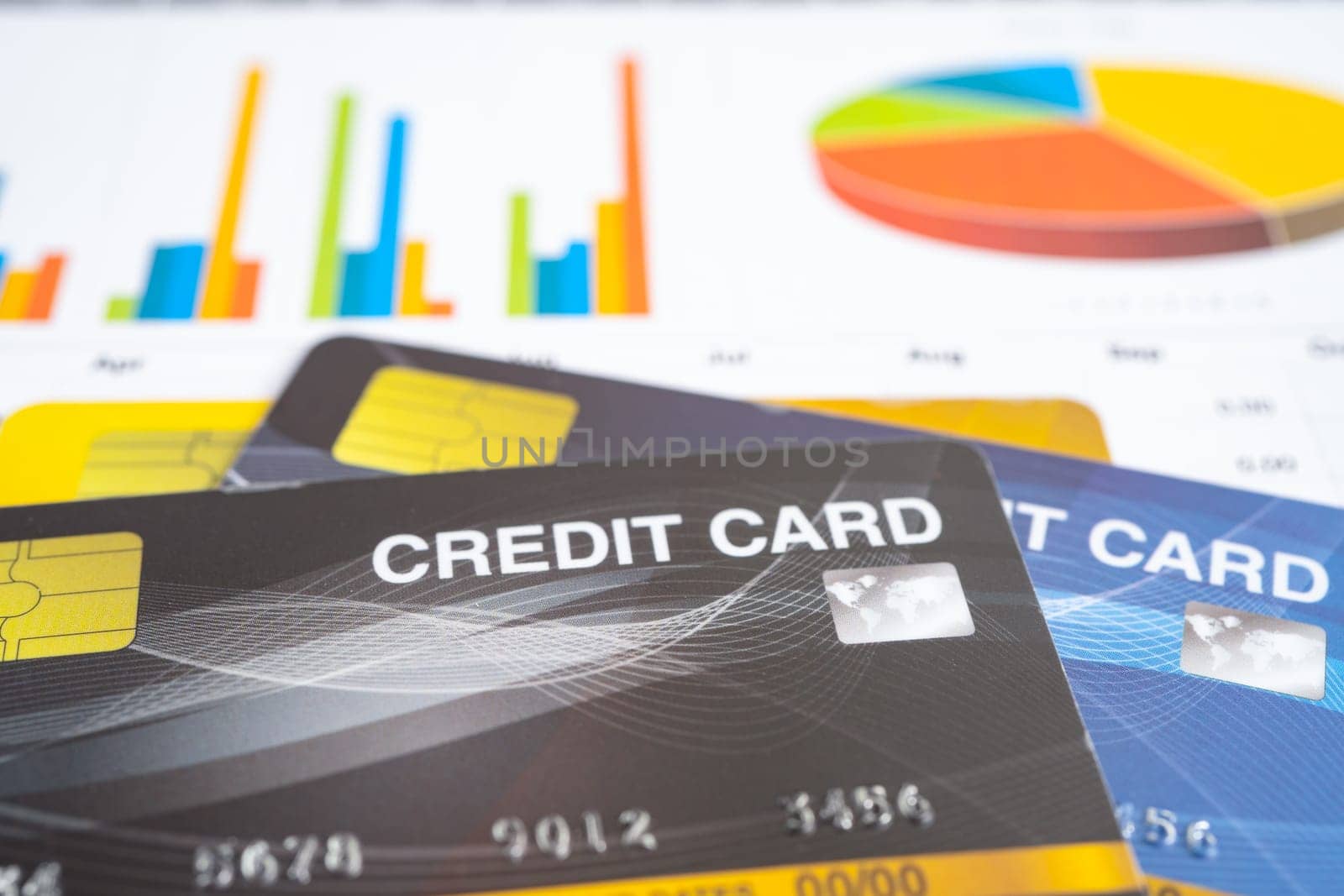 Credit card model on chart and graph spreadsheet paper. Finance development, Banking Account, Statistics, Investment Analytic research data economy, Stock exchange trading, Business company concept.