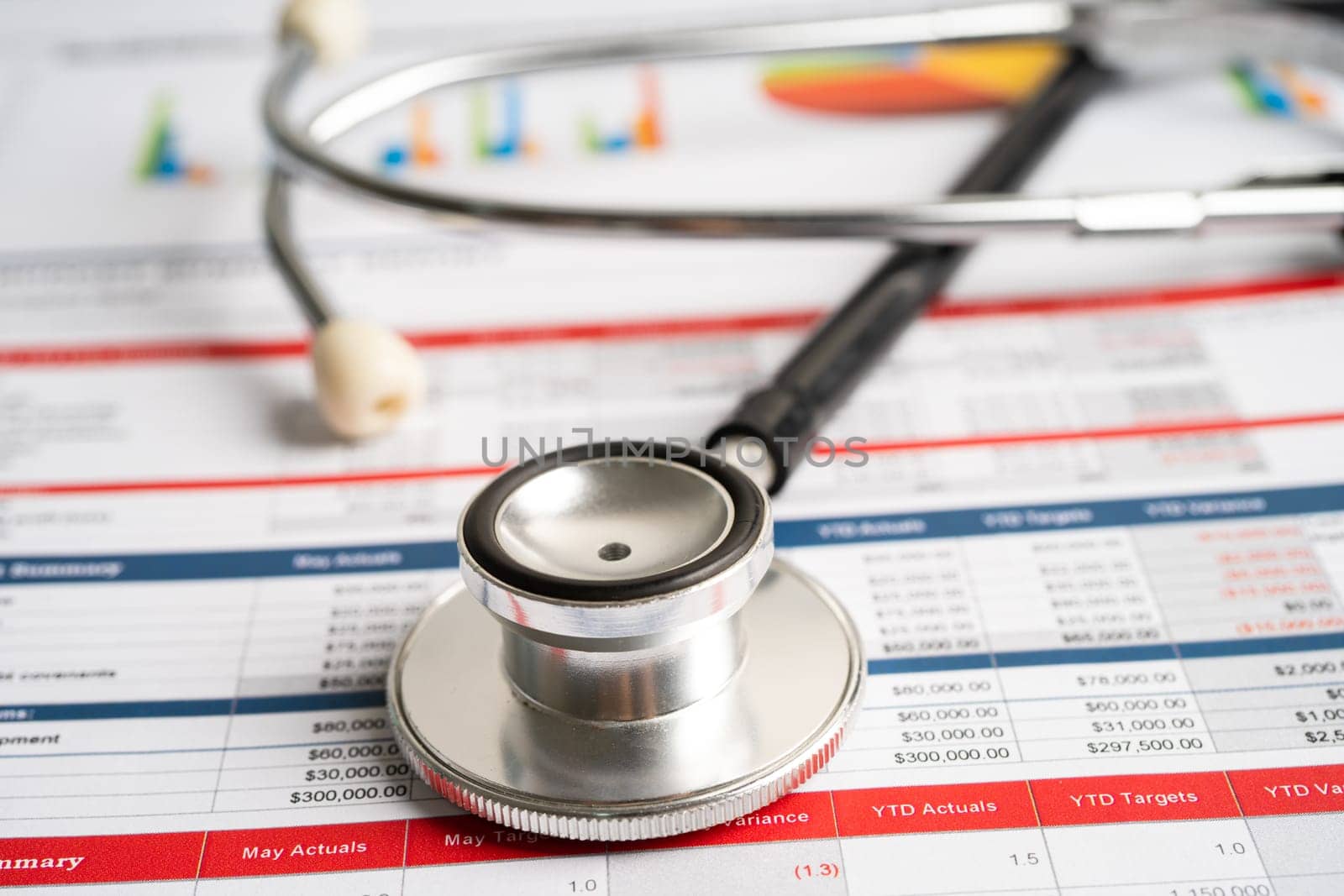 Stethoscope on spreadsheet and graph paper, Finance, Account, Statistics, Investment, Analytic research data economy and Business company concept.