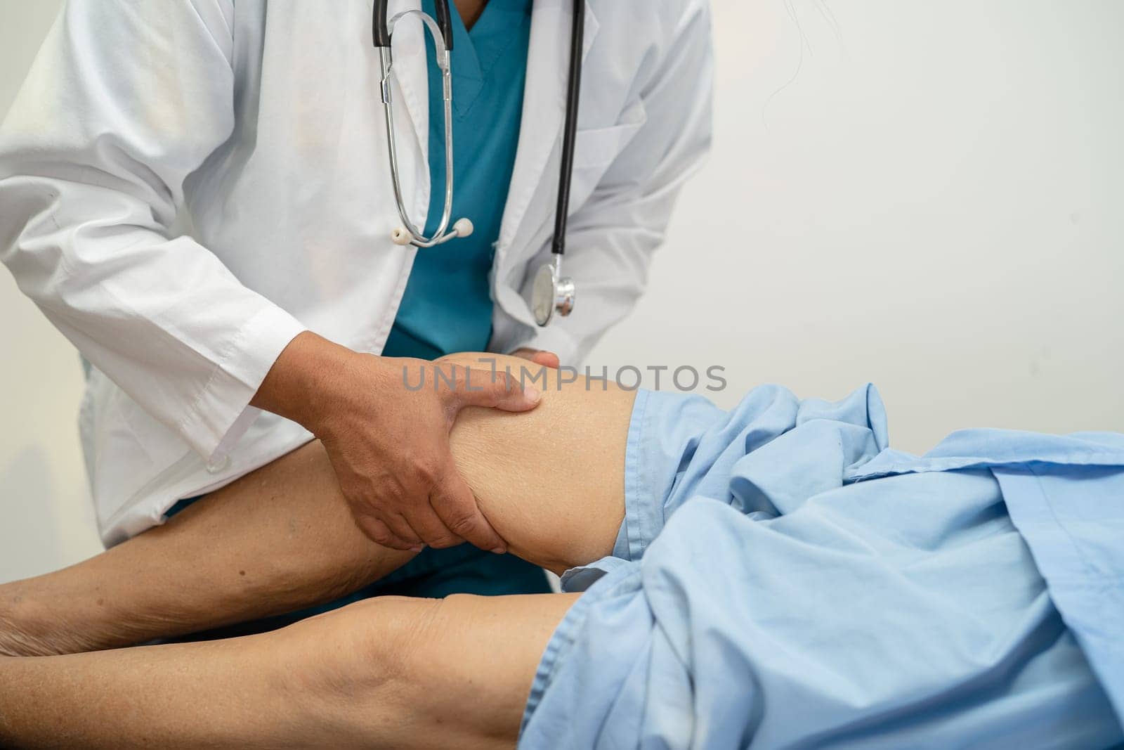 Asian elderly woman patient show her scars surgical total knee joint replacement Suture wound surgery arthroplasty on bed in hospital, healthy strong medical concept. by pamai