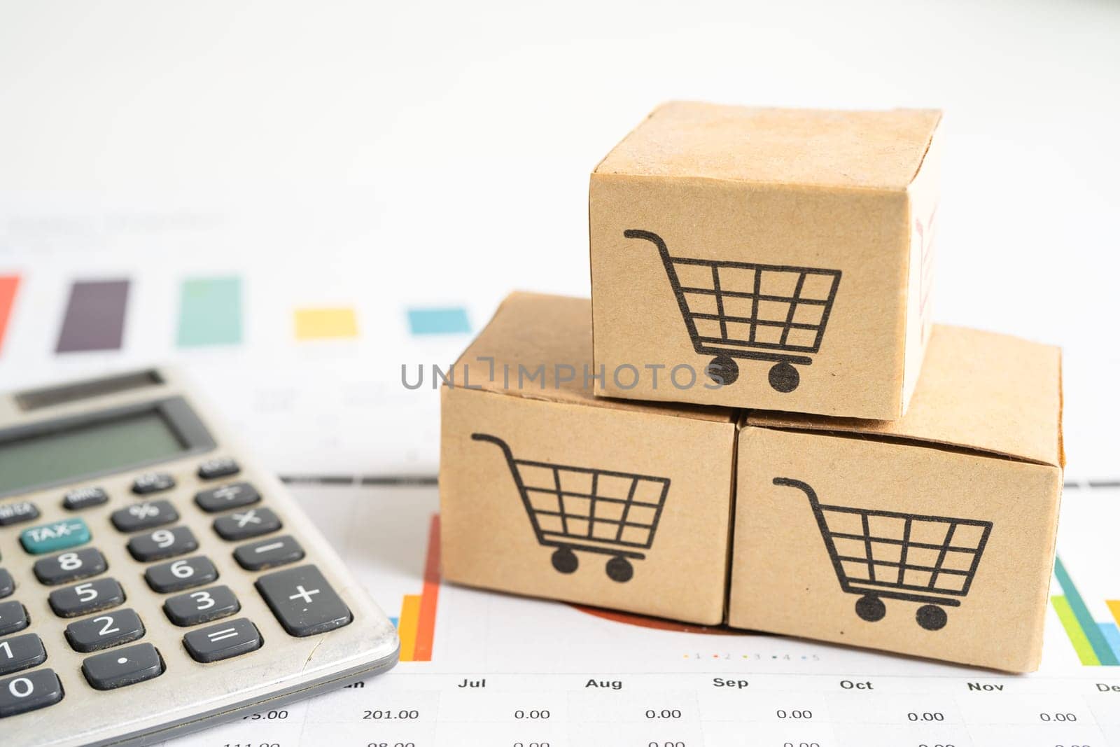 Shopping cart logo on box with magnifying glass on graph background. Banking Account, Investment Analytic research data economy, trading, Business import export transportation online company concept. by pamai