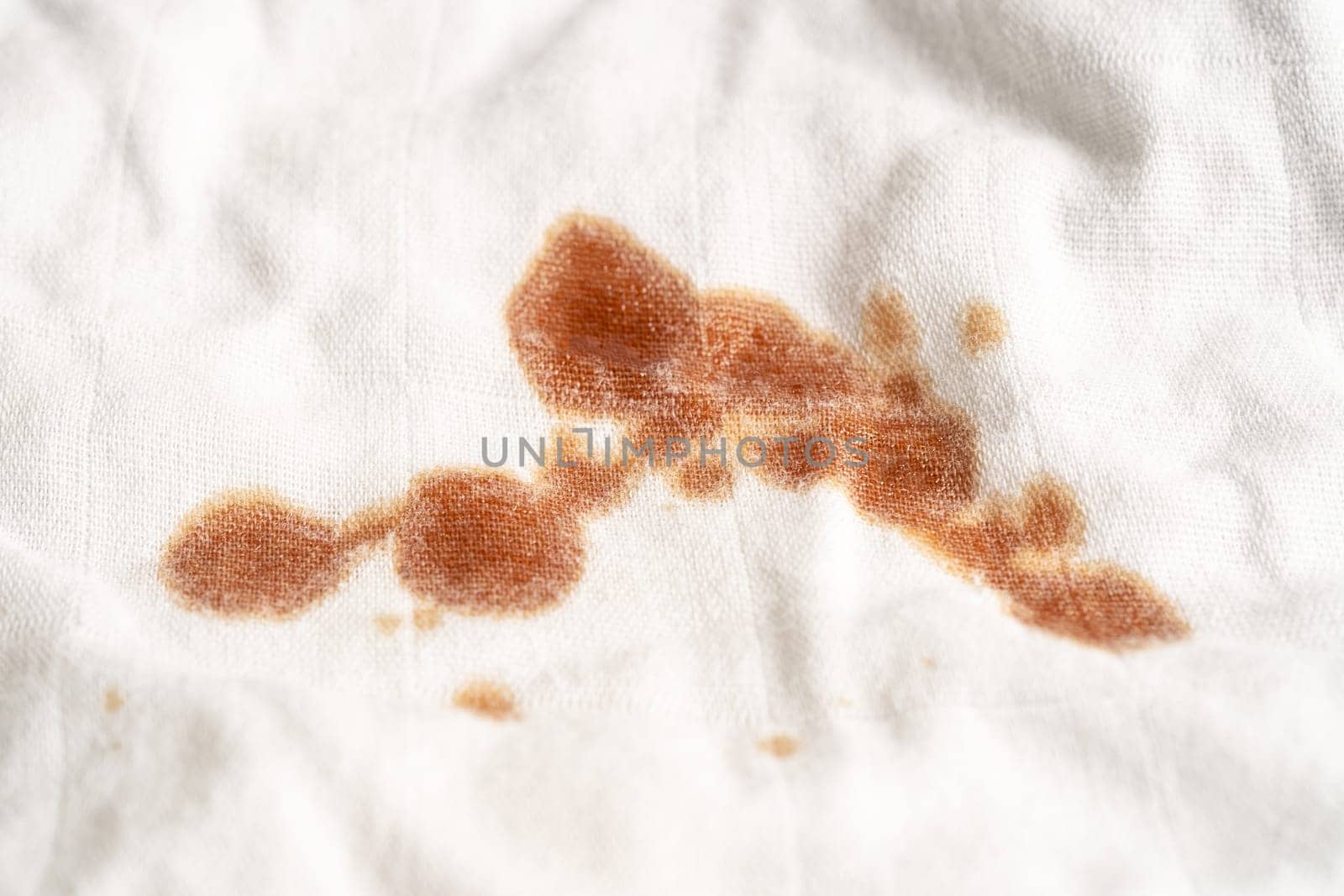 Dirty sauce stain on cloth to wash with washing powder, cleaning housework concept.