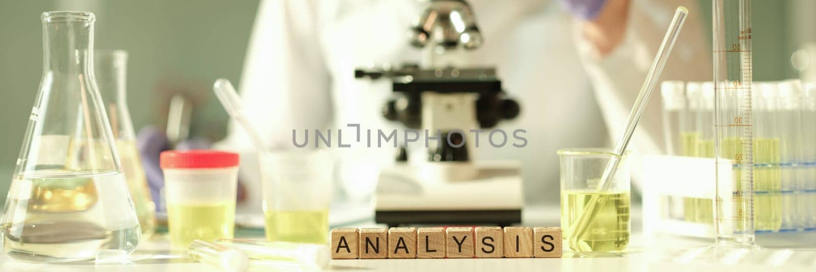 Doctor of laboratory diagnostics making general urine analysis in chemical lab closeup by kuprevich