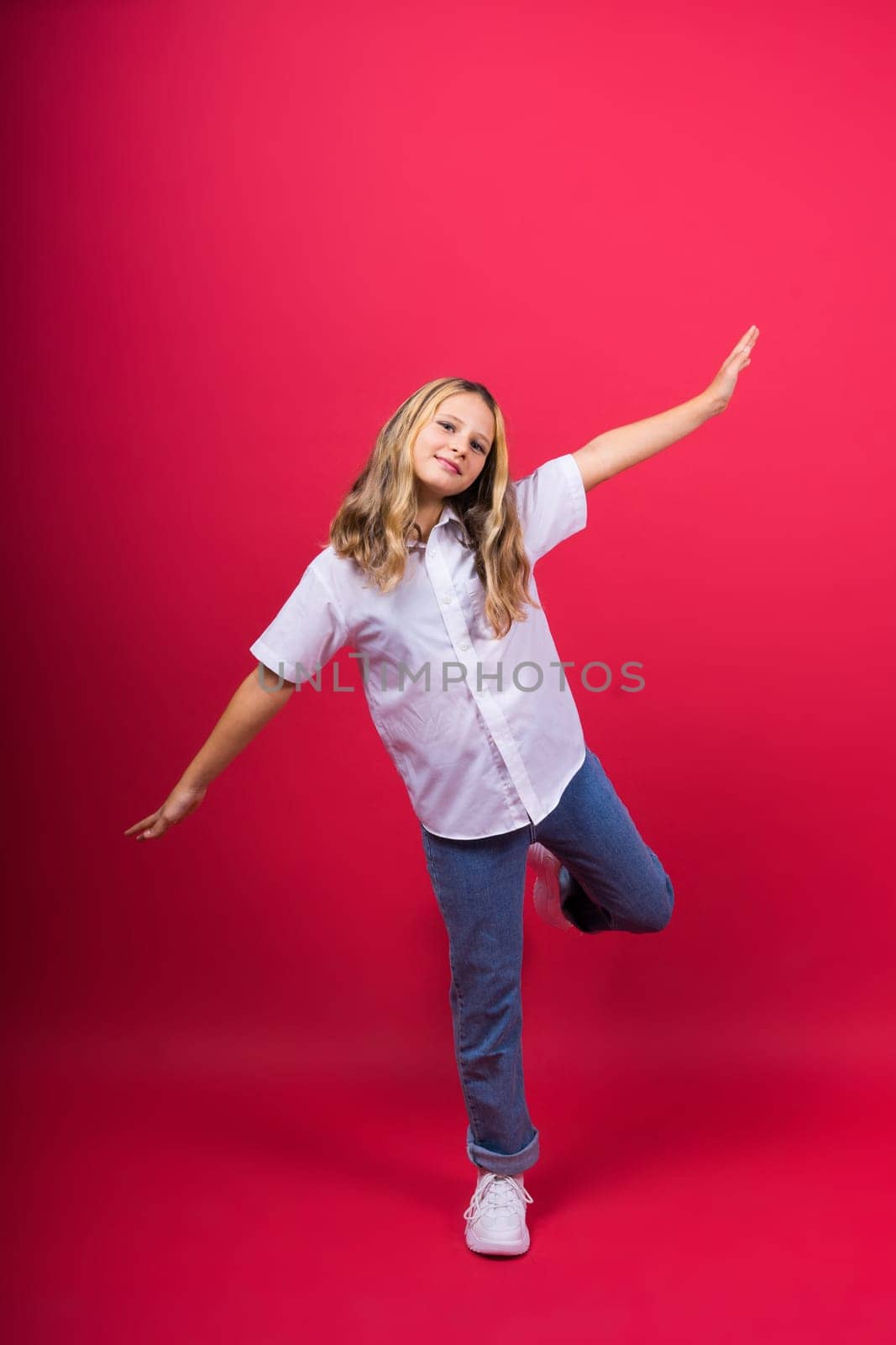 Little kid girl 12,13, 14 years old isolated background. Happy teenager, positive and smiling.