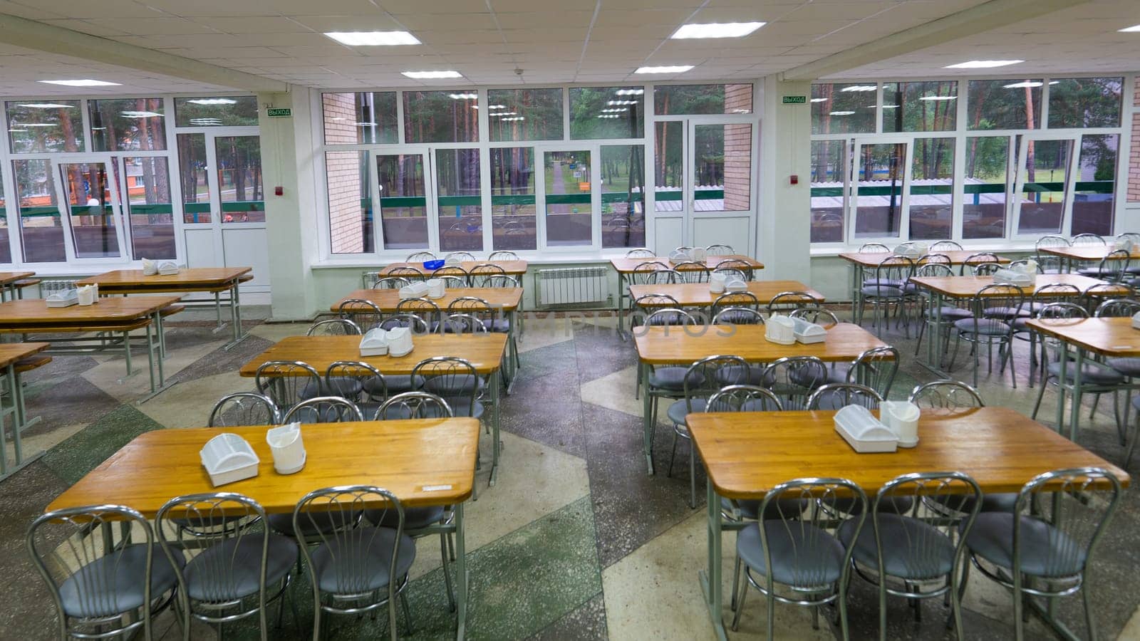 Chairs and tables. The dining hall in school is quarantined, isolation. by Zelenin