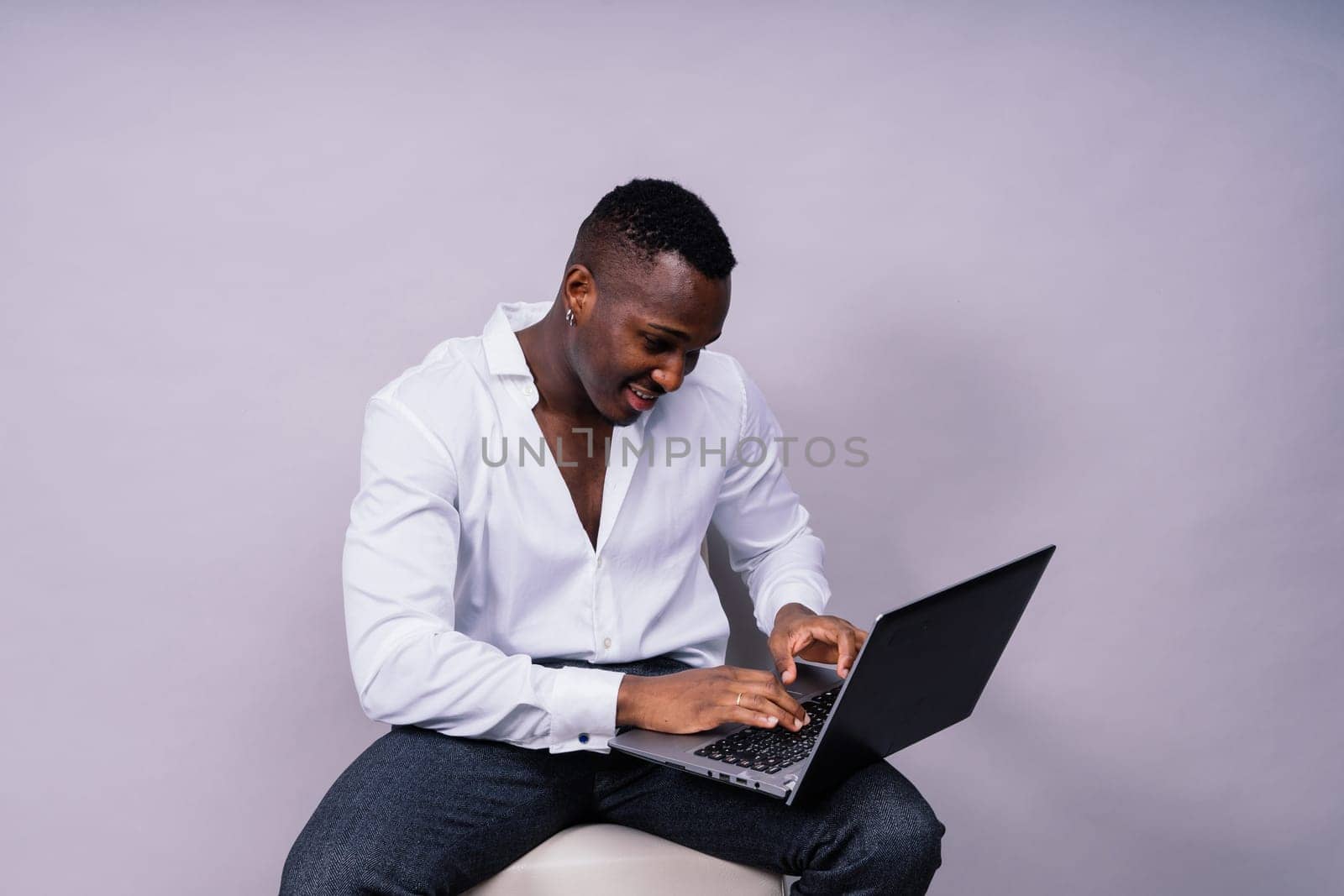 Happy african american young businessman in formal suit portrait. Confident black guy posing by Zelenin