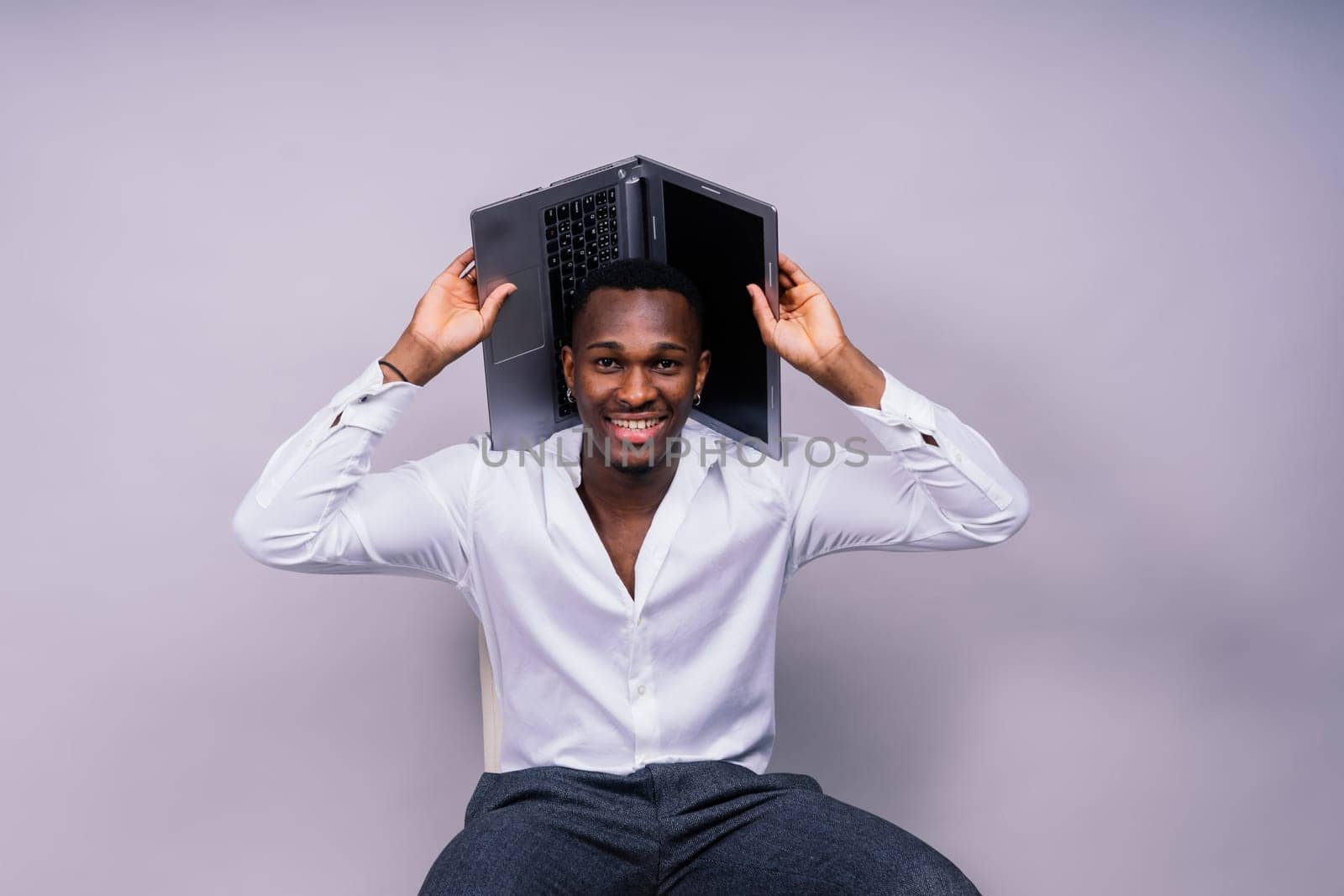 African American millennial businessman isolated on a studio background, successful male formal suit