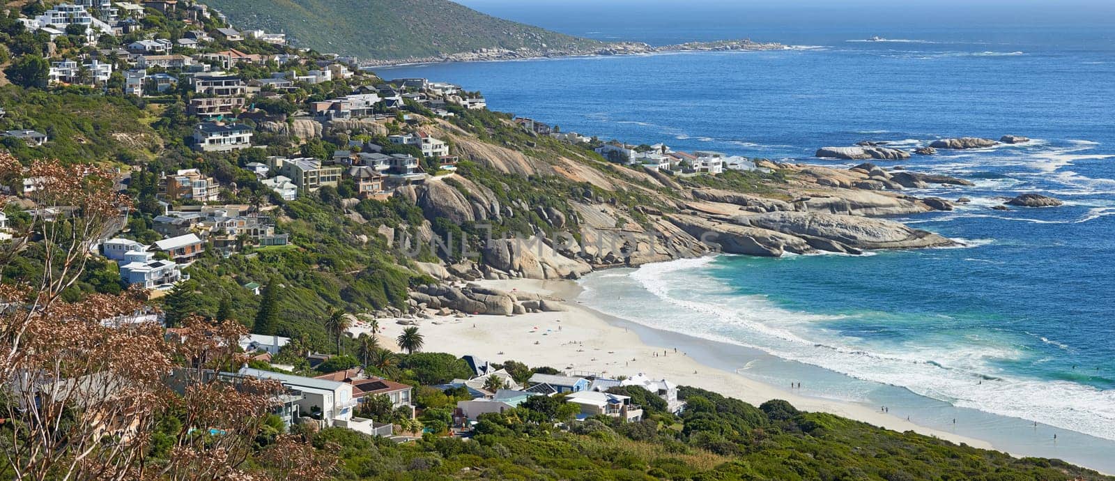 Mountain, beach and aerial of city by ocean in South Africa for tourism, traveling and global destination. Landscape, background and view of sea by urban town for adventure, vacation and holiday.