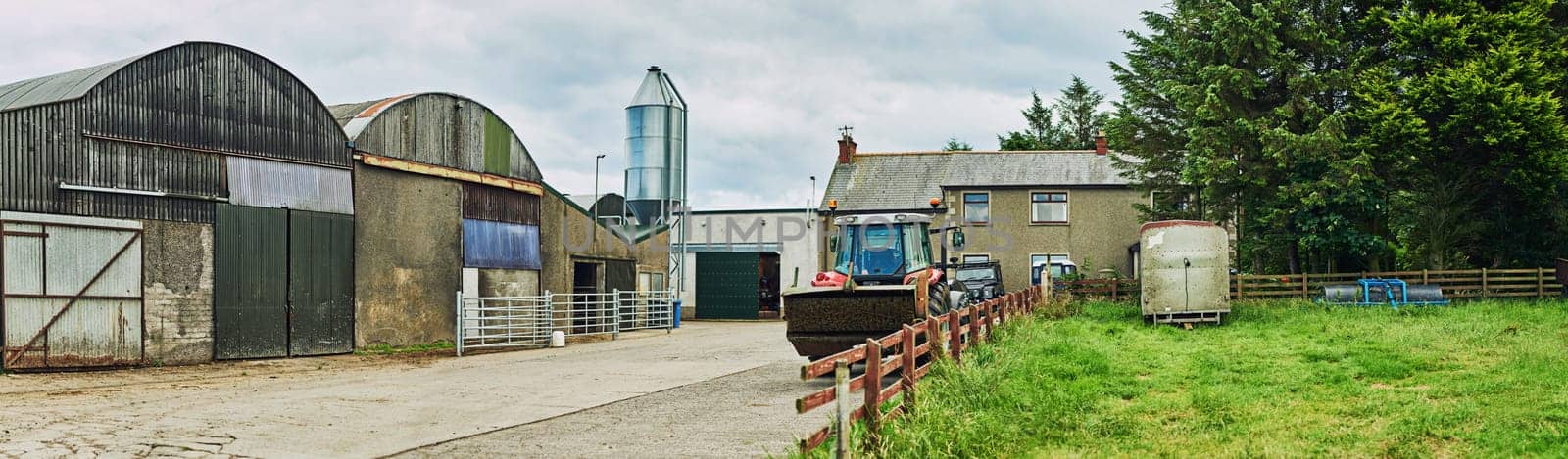 The picture of a well-kept farm. a dairy factory on wide open farmland in the countryside