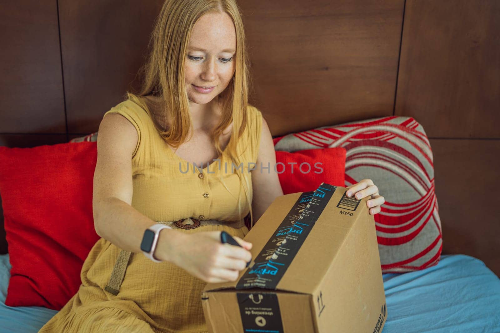 12.21.22, Mexico, Playa del Carmen: A pregnant woman received a package from Amazon. Products for pregnant women and babies on Amazon by galitskaya