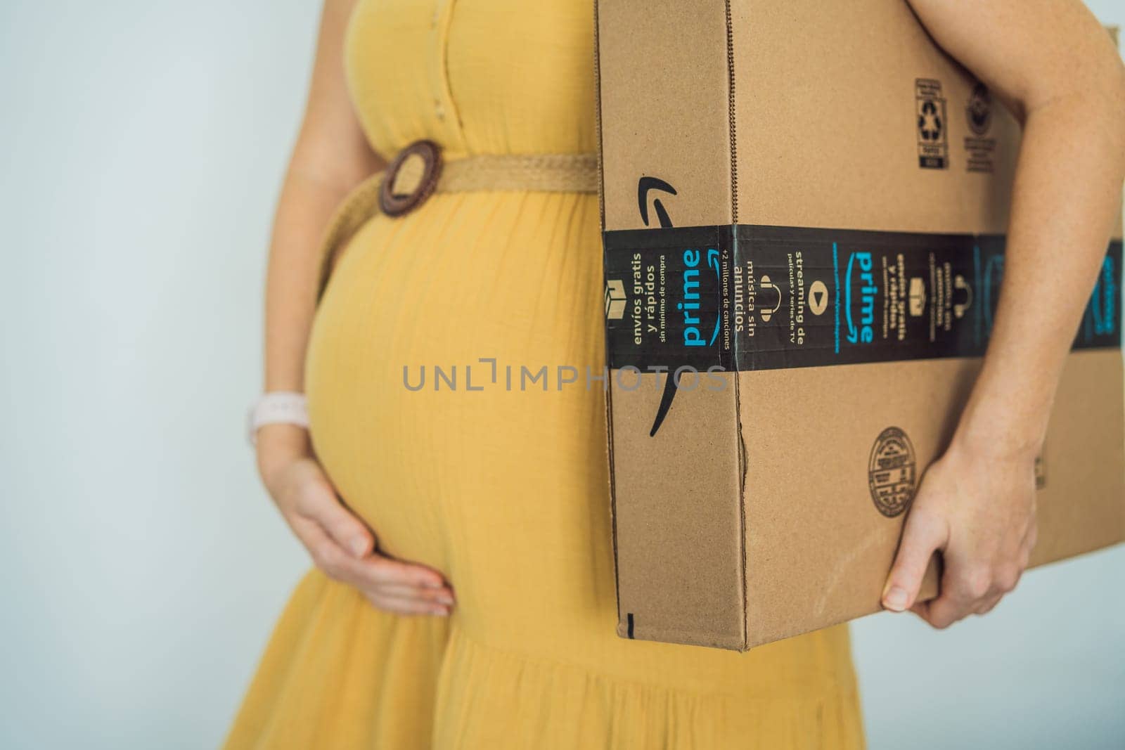 12.21.22, Mexico, Playa del Carmen: A pregnant woman received a package from Amazon. Products for pregnant women and babies on Amazon by galitskaya
