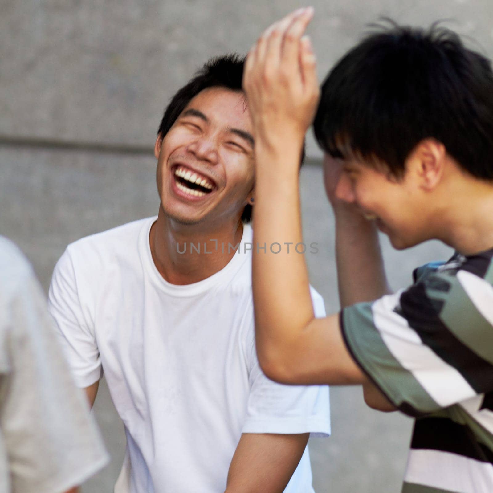 Friends, laughing and portrait of asian teenager with happiness, freedom and funny conversation on weekend or holiday. Joke, comedy and smile on face of Japanese teen boy or college student in group.