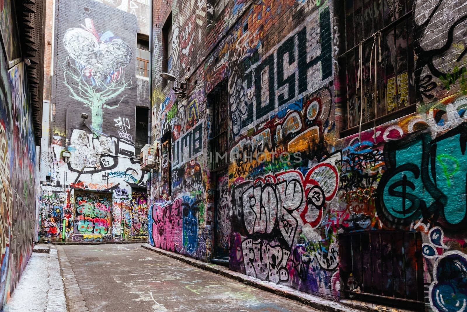 MELBOURNE, AUSTRALIA - June 25 2023: Melbourne's famous Hosier Lane featuring graffiti artwork and grunge urban feel